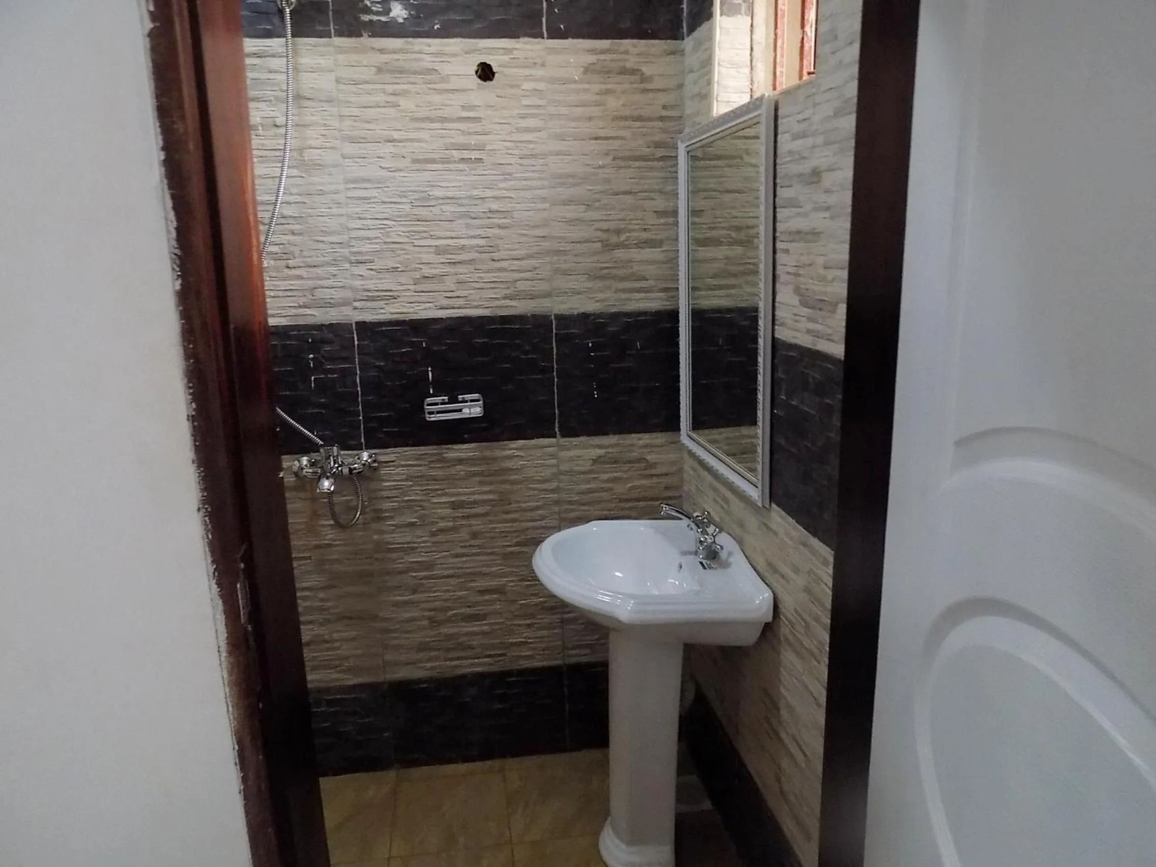 Bathroom in Remmings Hotel Kampala