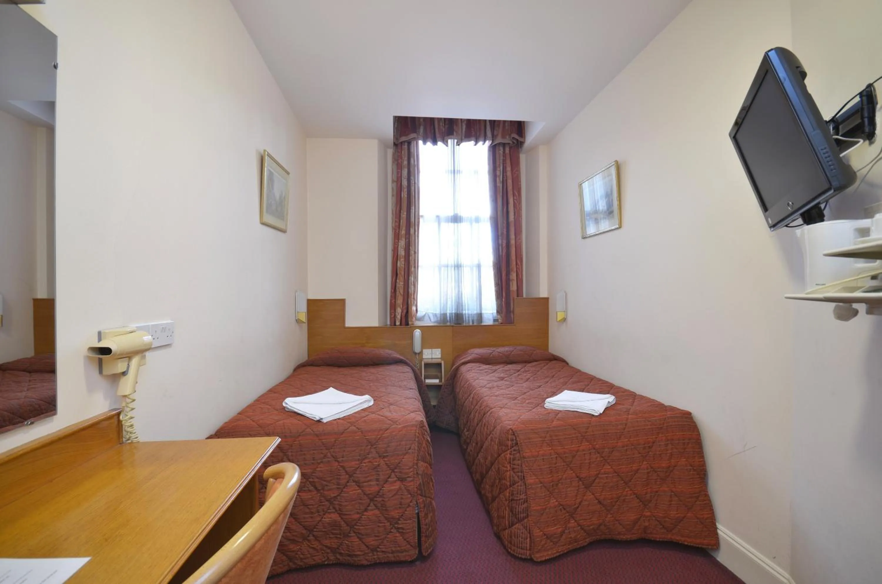 Bed in Seymour Hotel