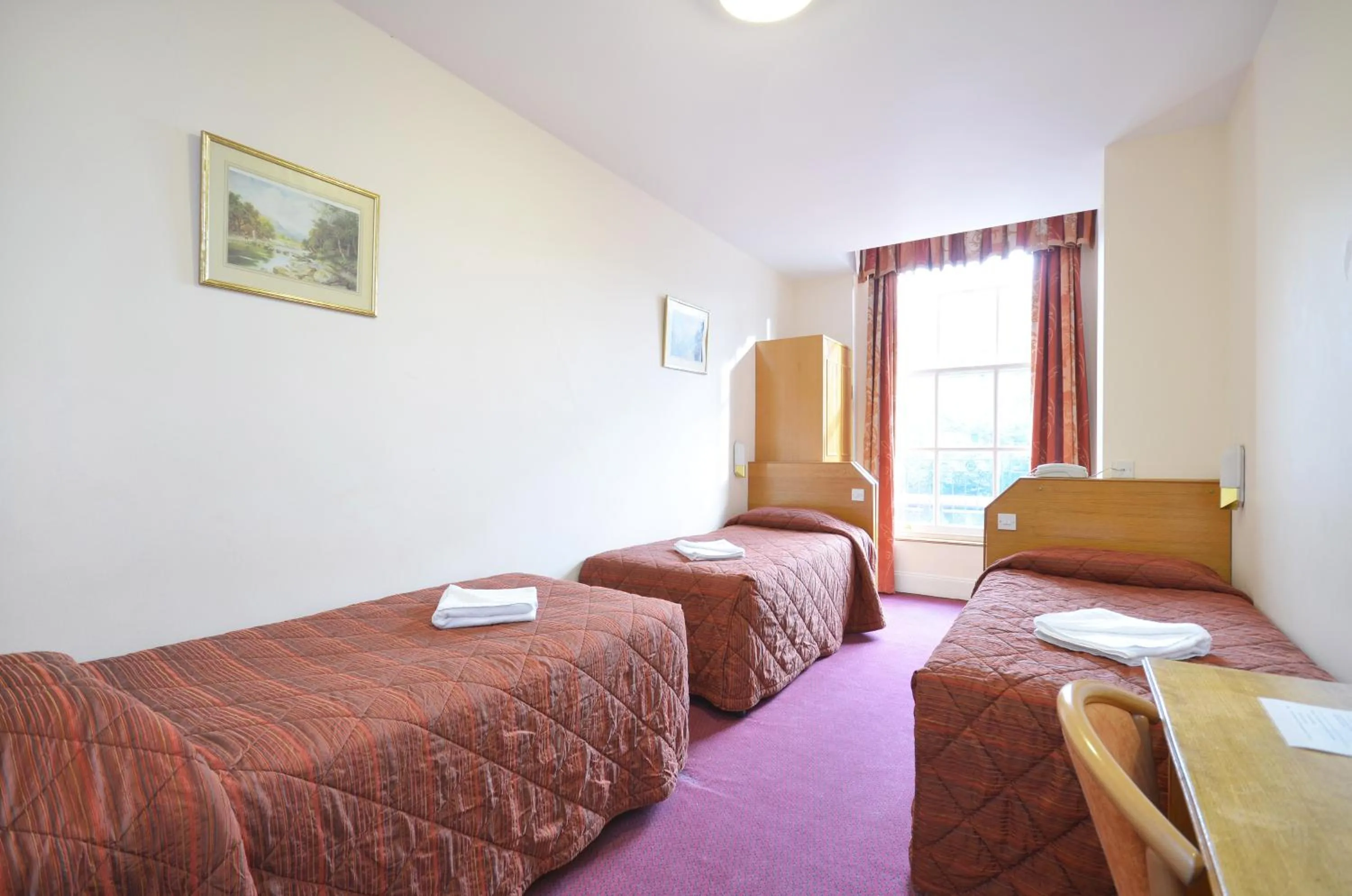 Bed in Seymour Hotel