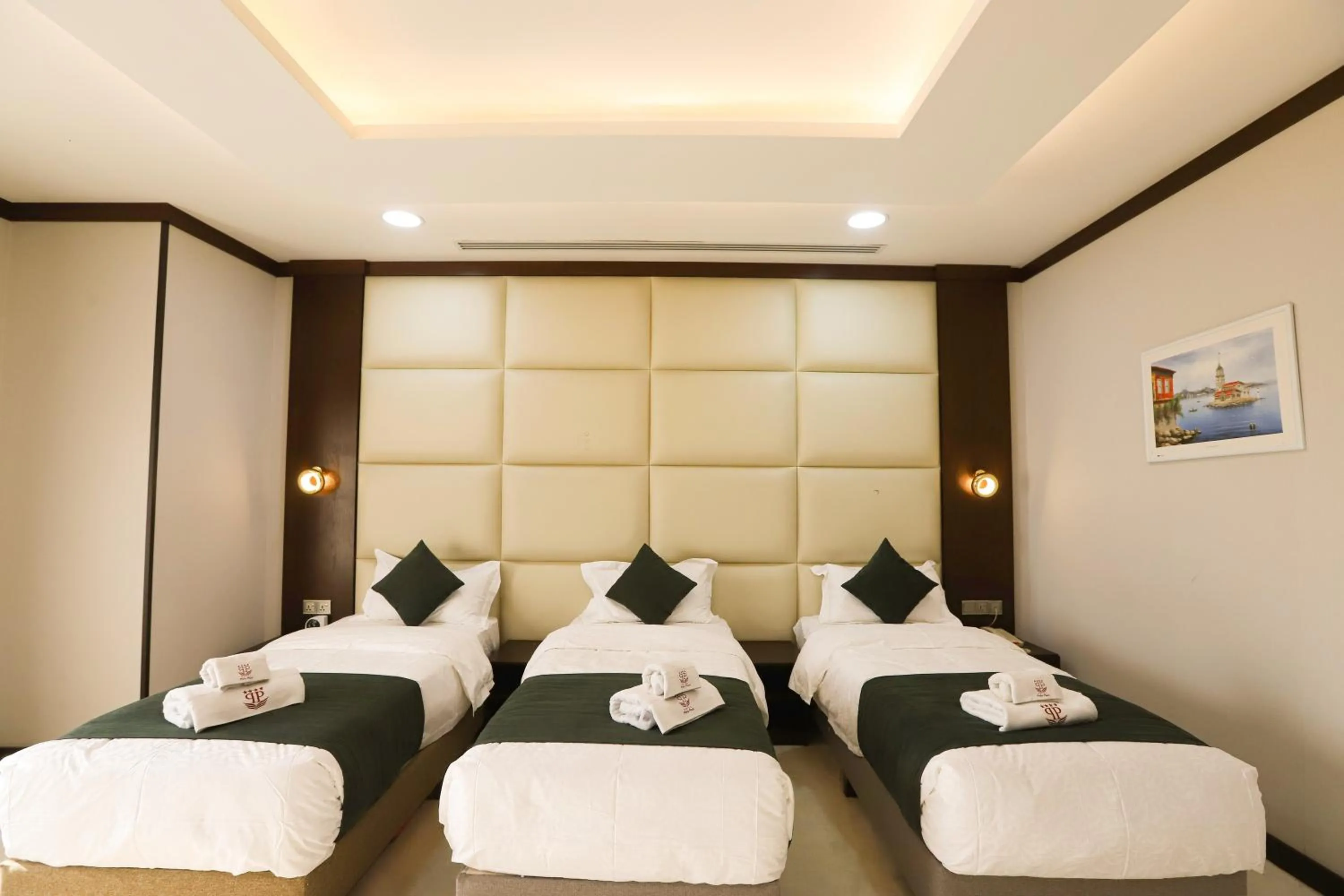 Bed in Paris Plaza Hotel