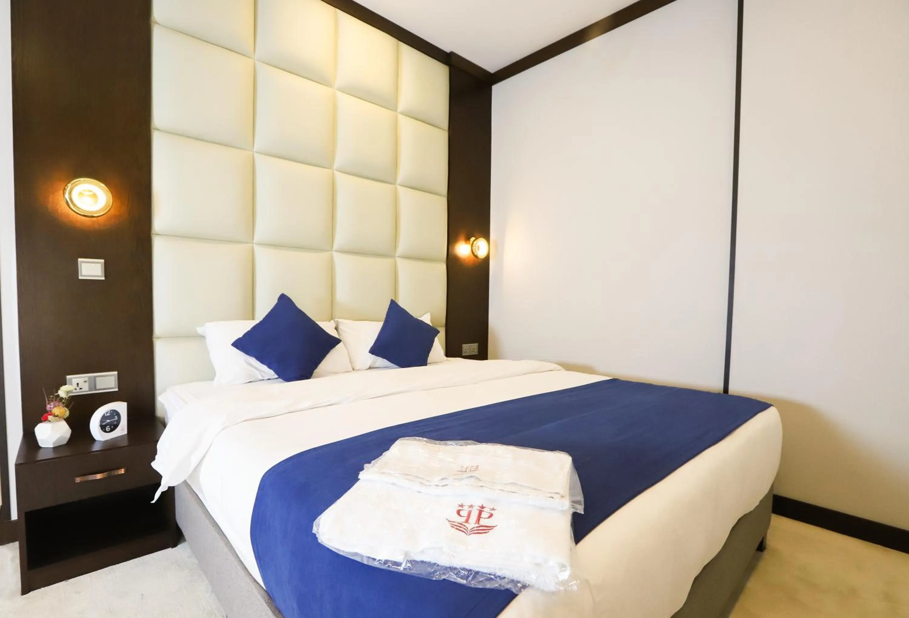 Bed in Paris Plaza Hotel