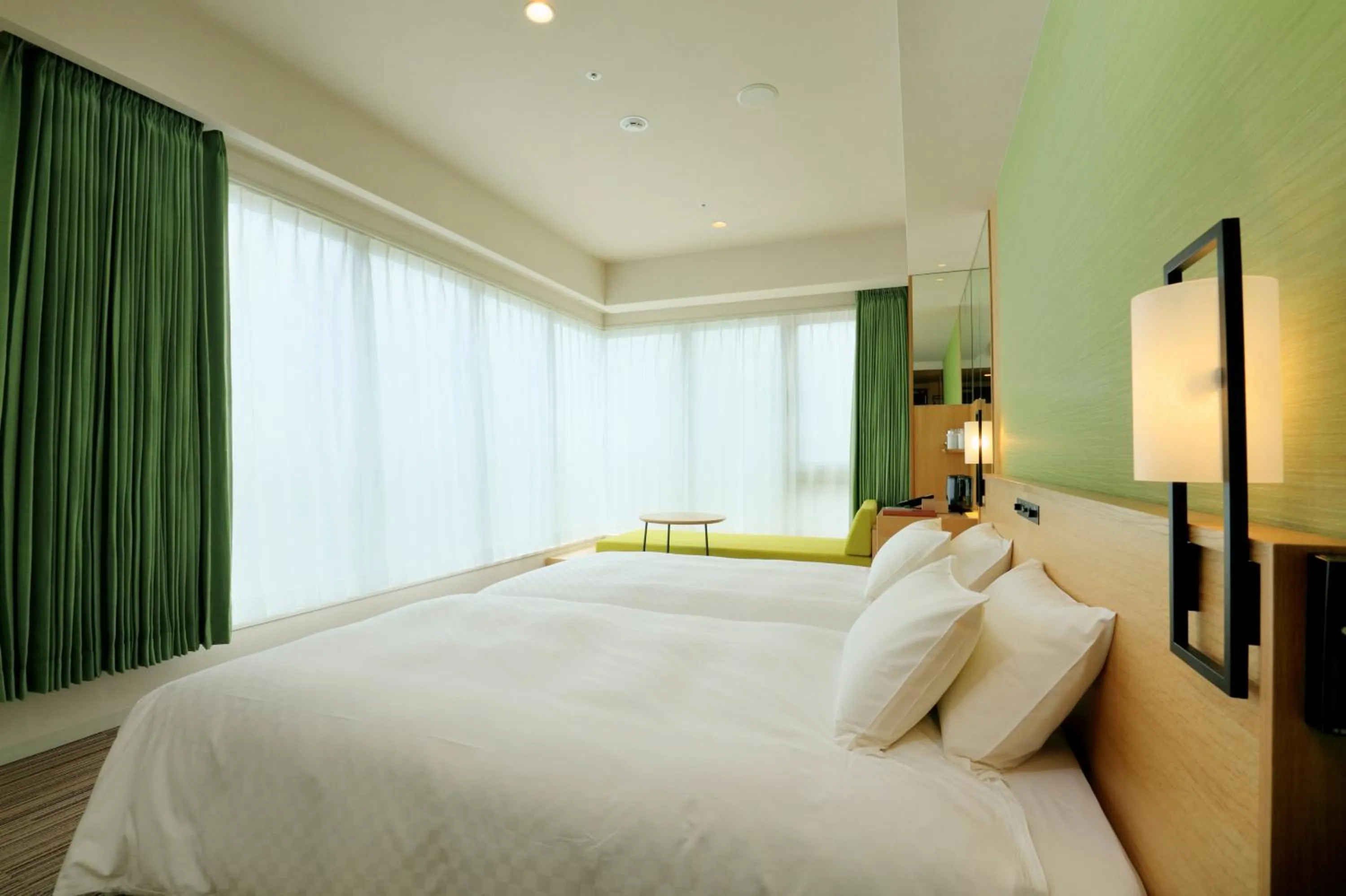 Bed in THE SINGULARI HOTEL & SKYSPA at UNIVERSAL STUDIOS JAPAN