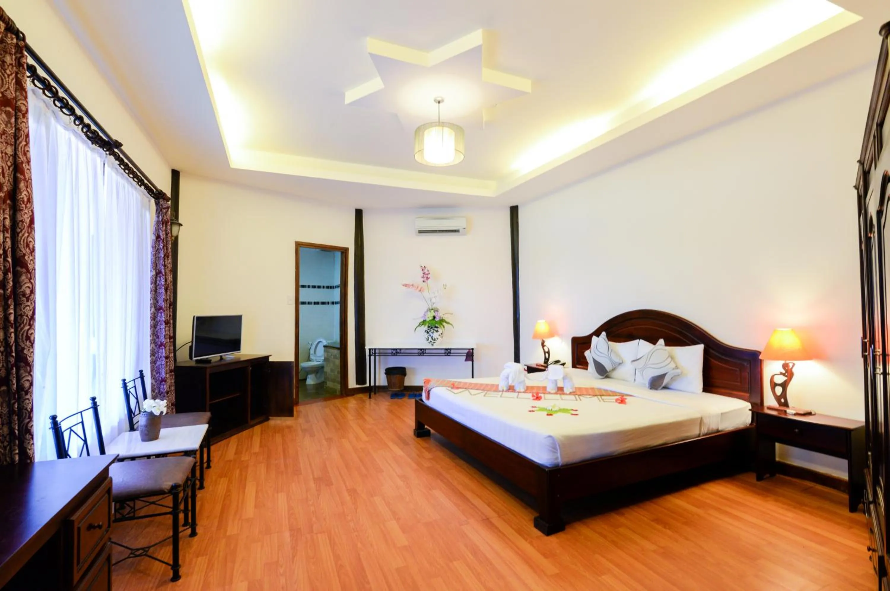 Photo of the whole room, Bed in Four Oceans Beach Resort - Bon Bien Mui Ne