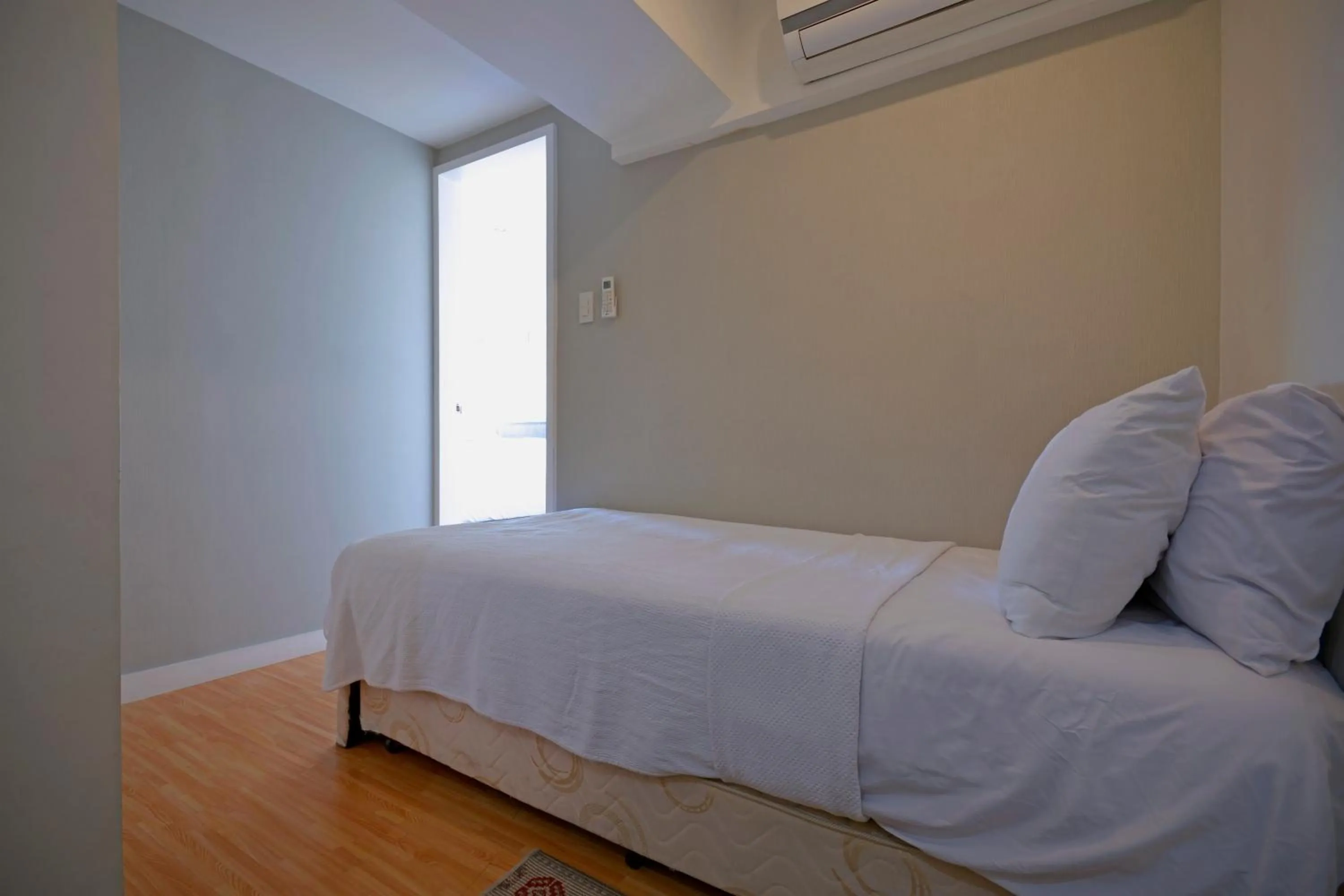 Bed in Victoria SOHO Suites