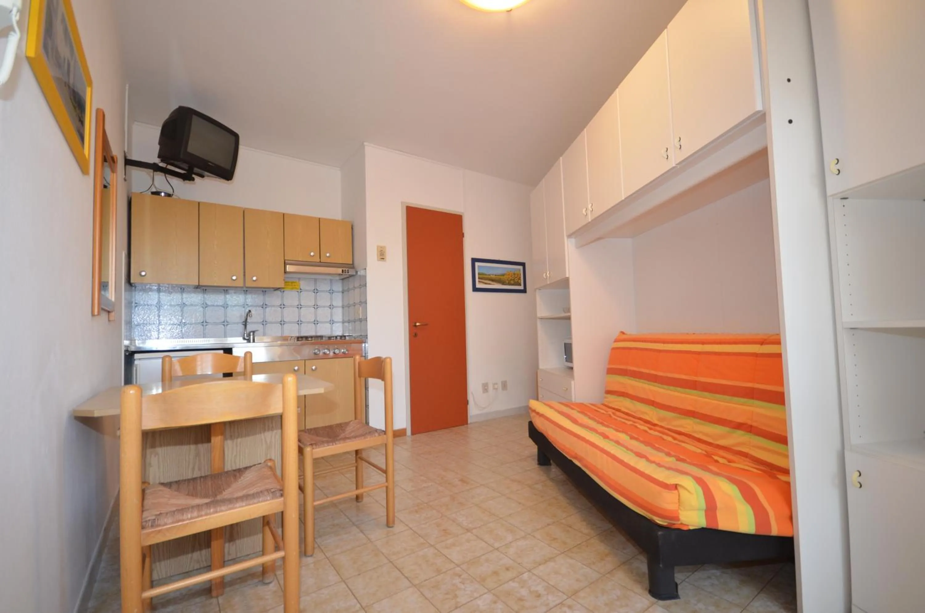 Kitchen or kitchenette, Bed in Appartamenti I Moschettieri