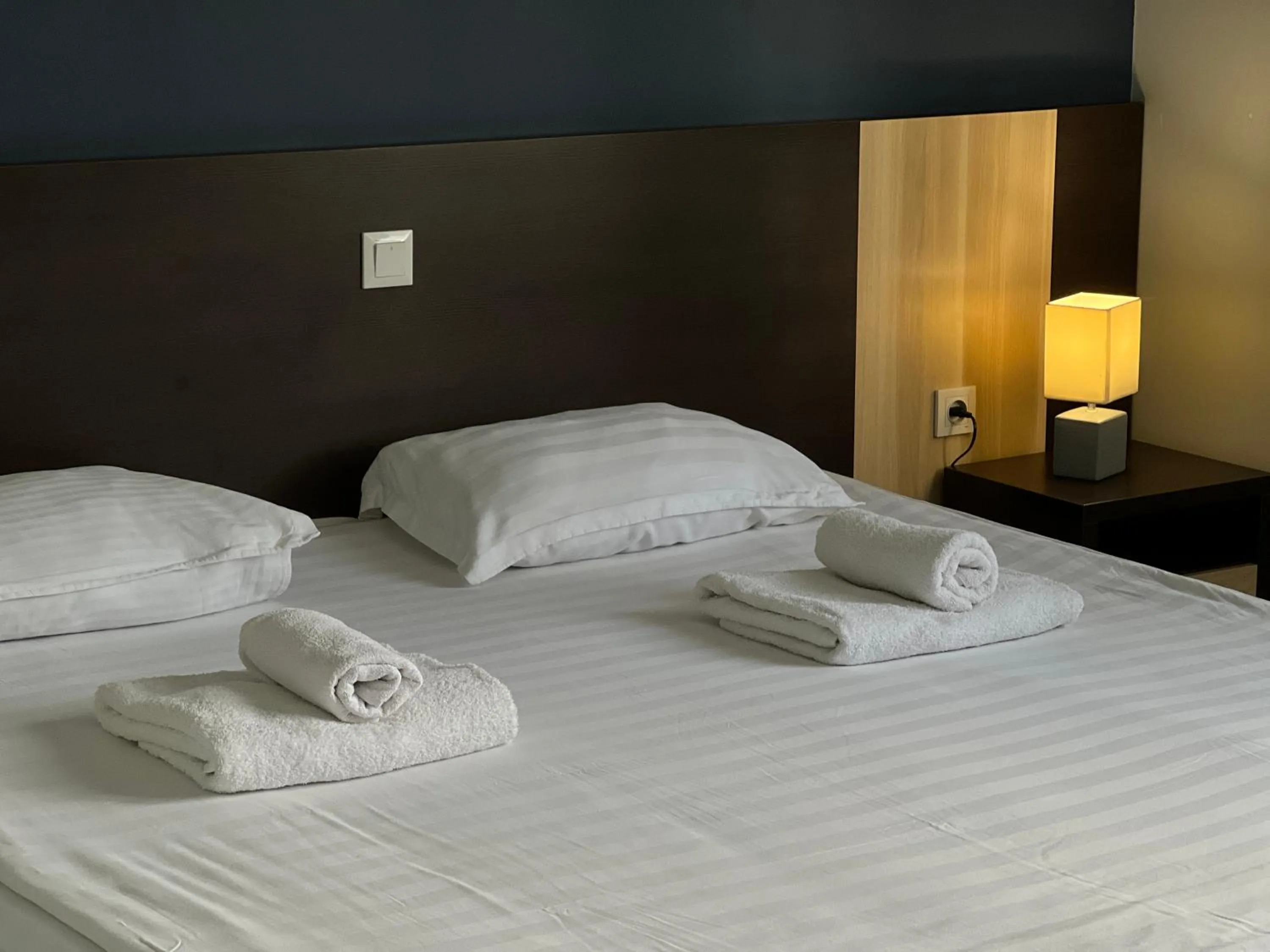 Bed in TourAsia Hotel