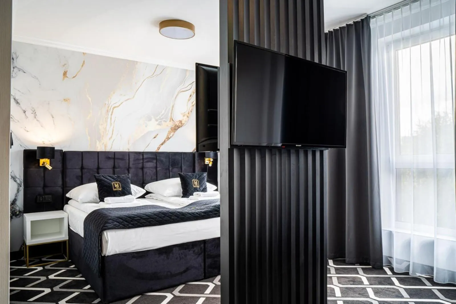 Bed in Hotel Lantier & Swimming Pool Zone