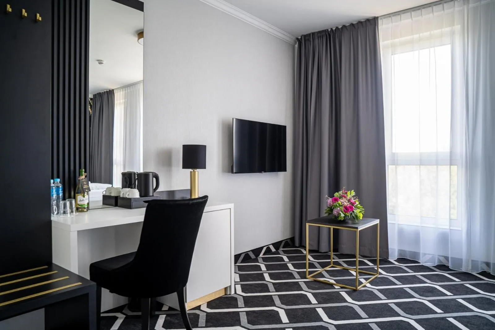 Communal lounge/ TV room in Hotel Lantier & Swimming Pool Zone