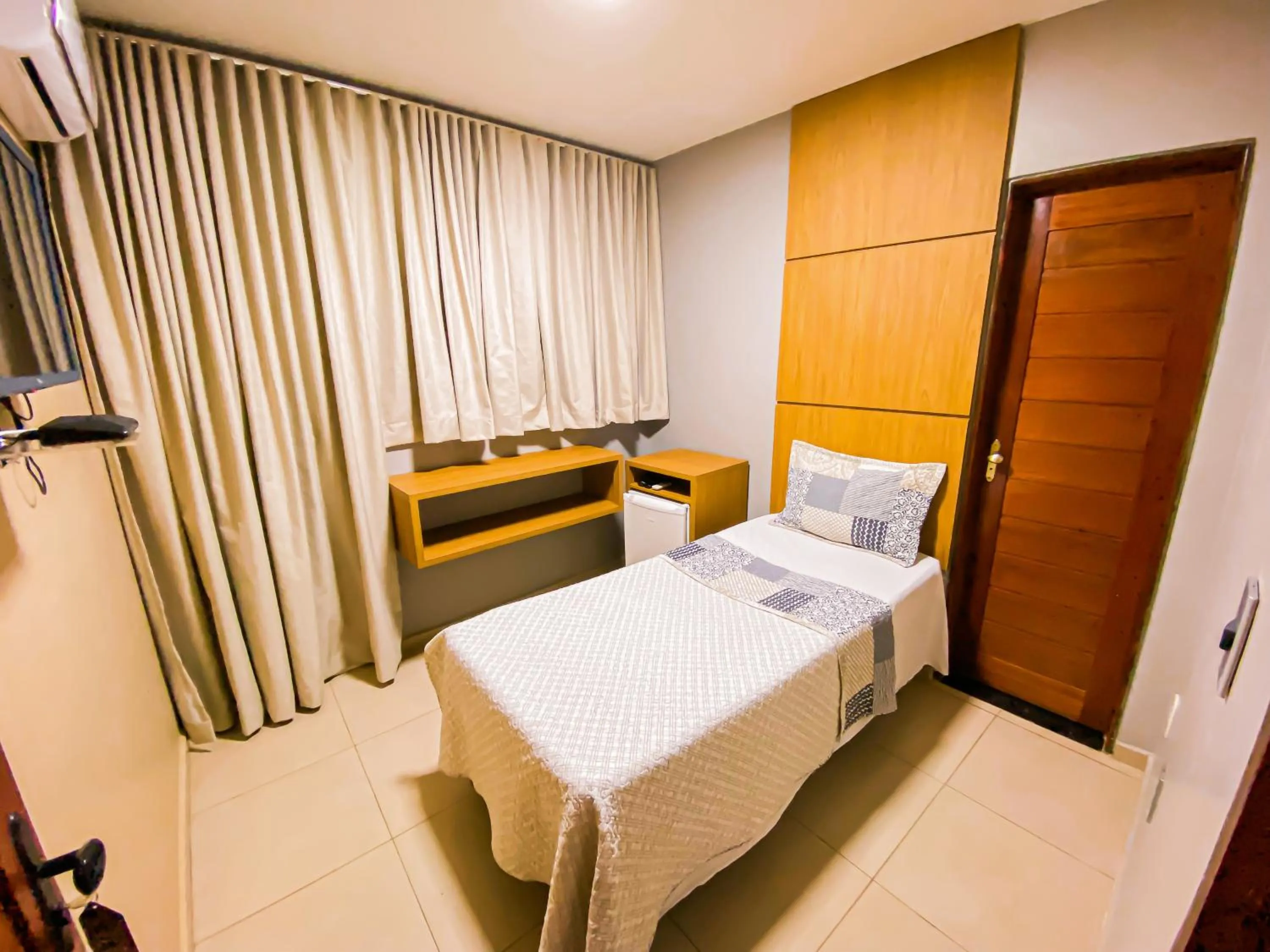 Bed in Hotel Pequeno Principe