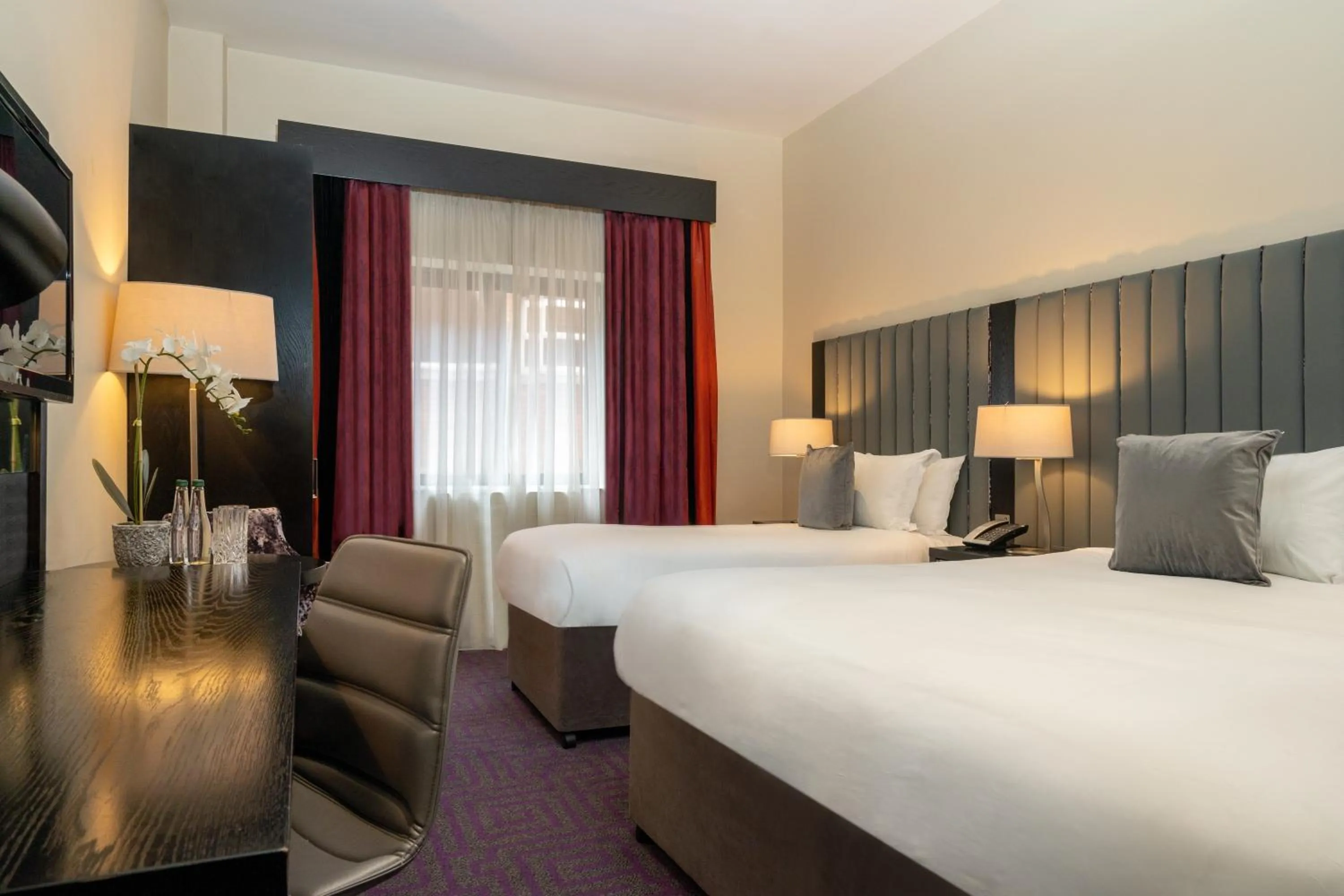 Bed in The Trinity City Hotel