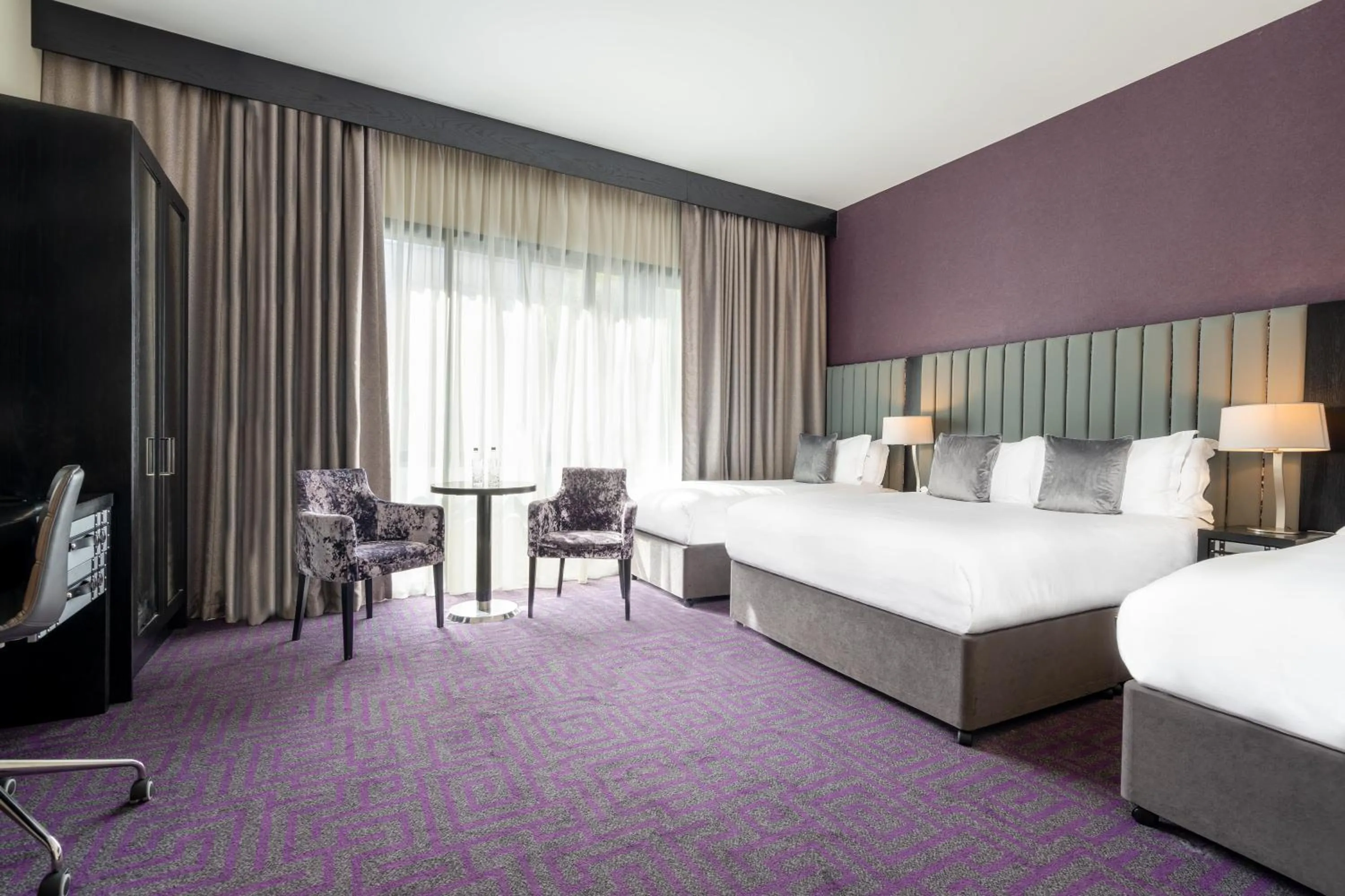 Bed in The Trinity City Hotel