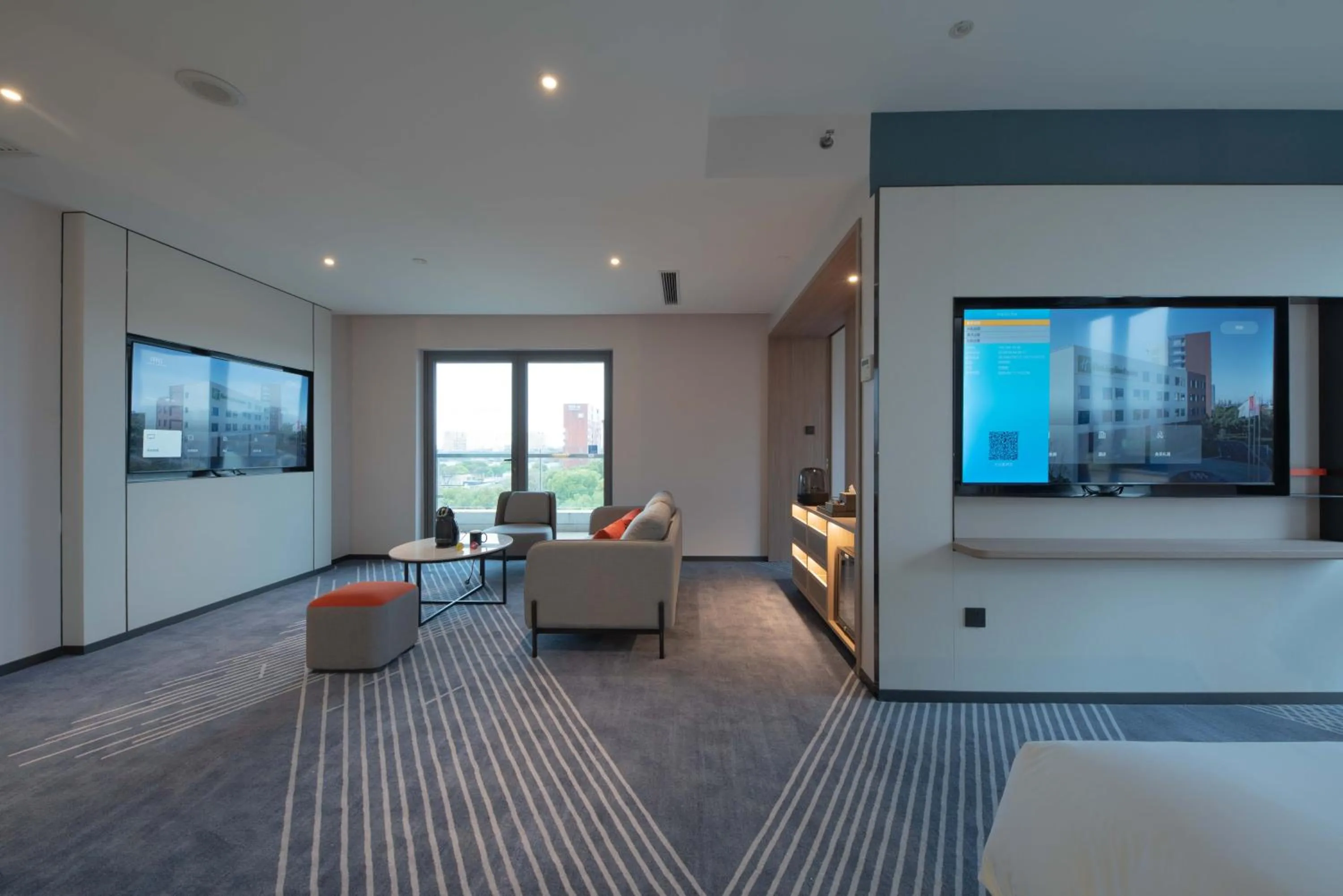 Living room in Holiday Inn Express Shanghai Pujiang by IHG
