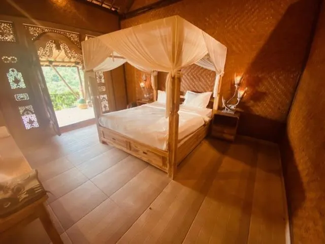 Bed in Sing Sing Resort Lovina