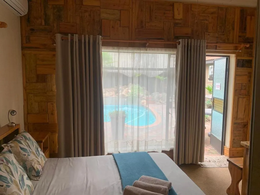Bed in Nkwasi Lodge
