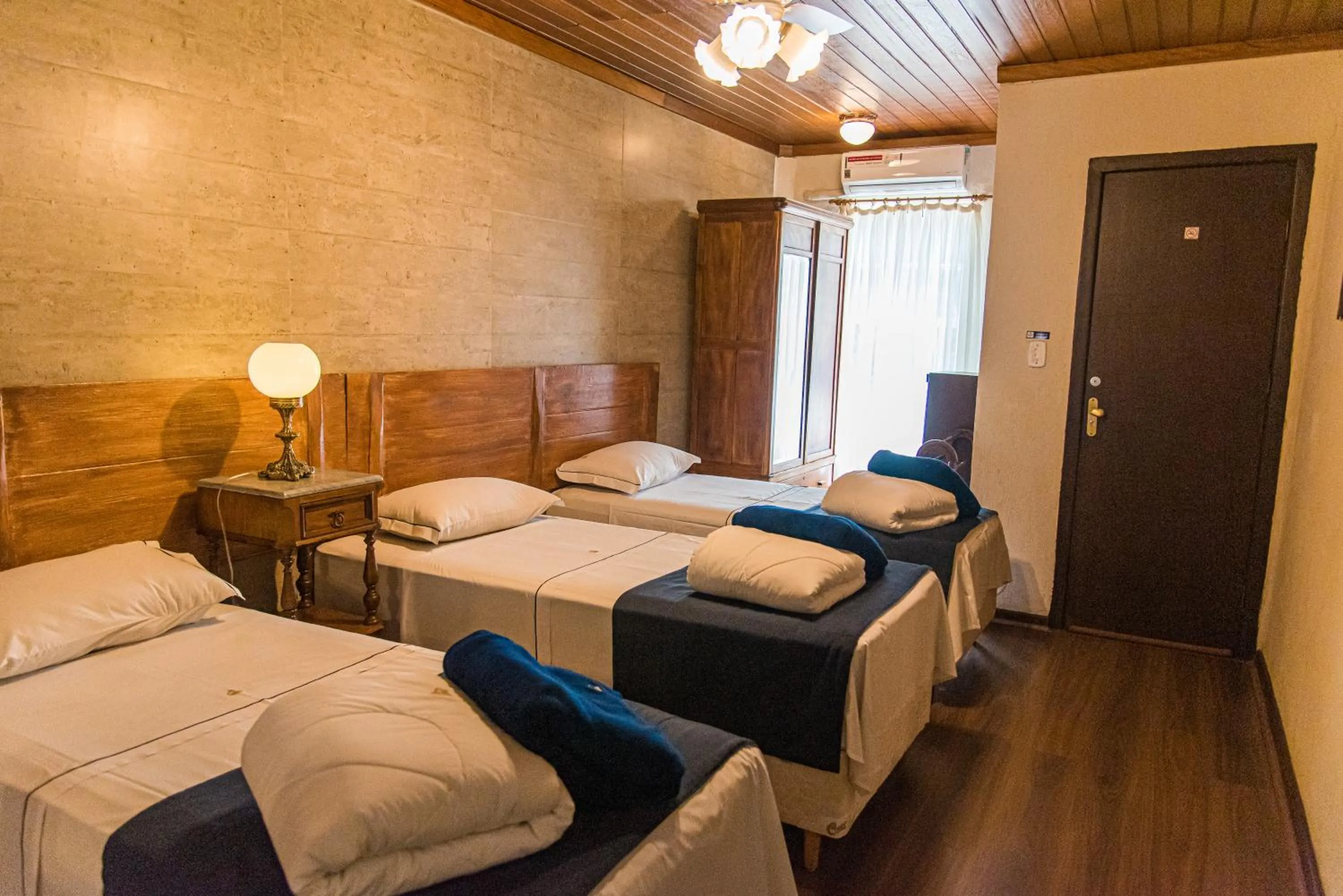 Bed in Pousada Dom Petrópolis