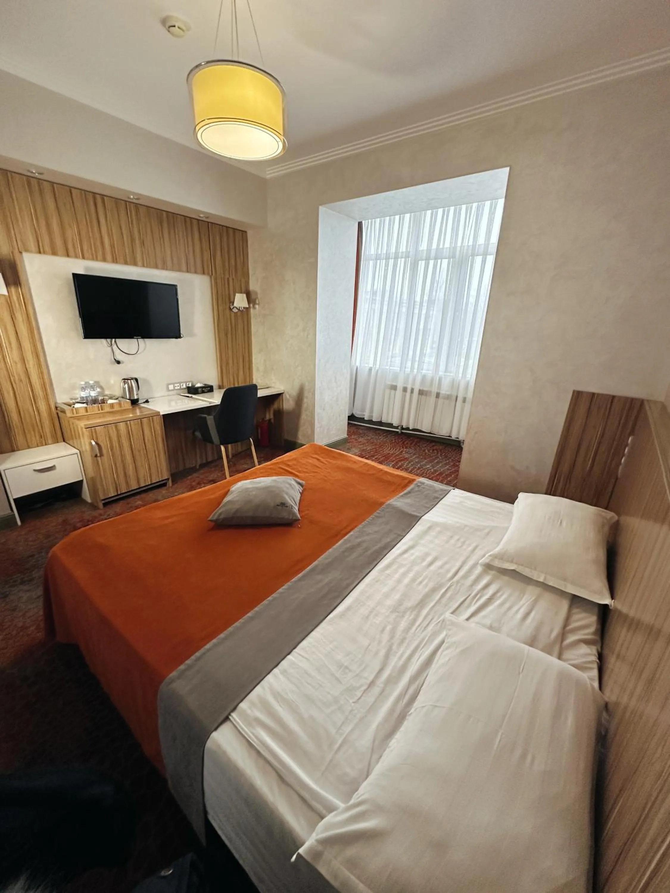 Bed in Mildom Premium Hotel