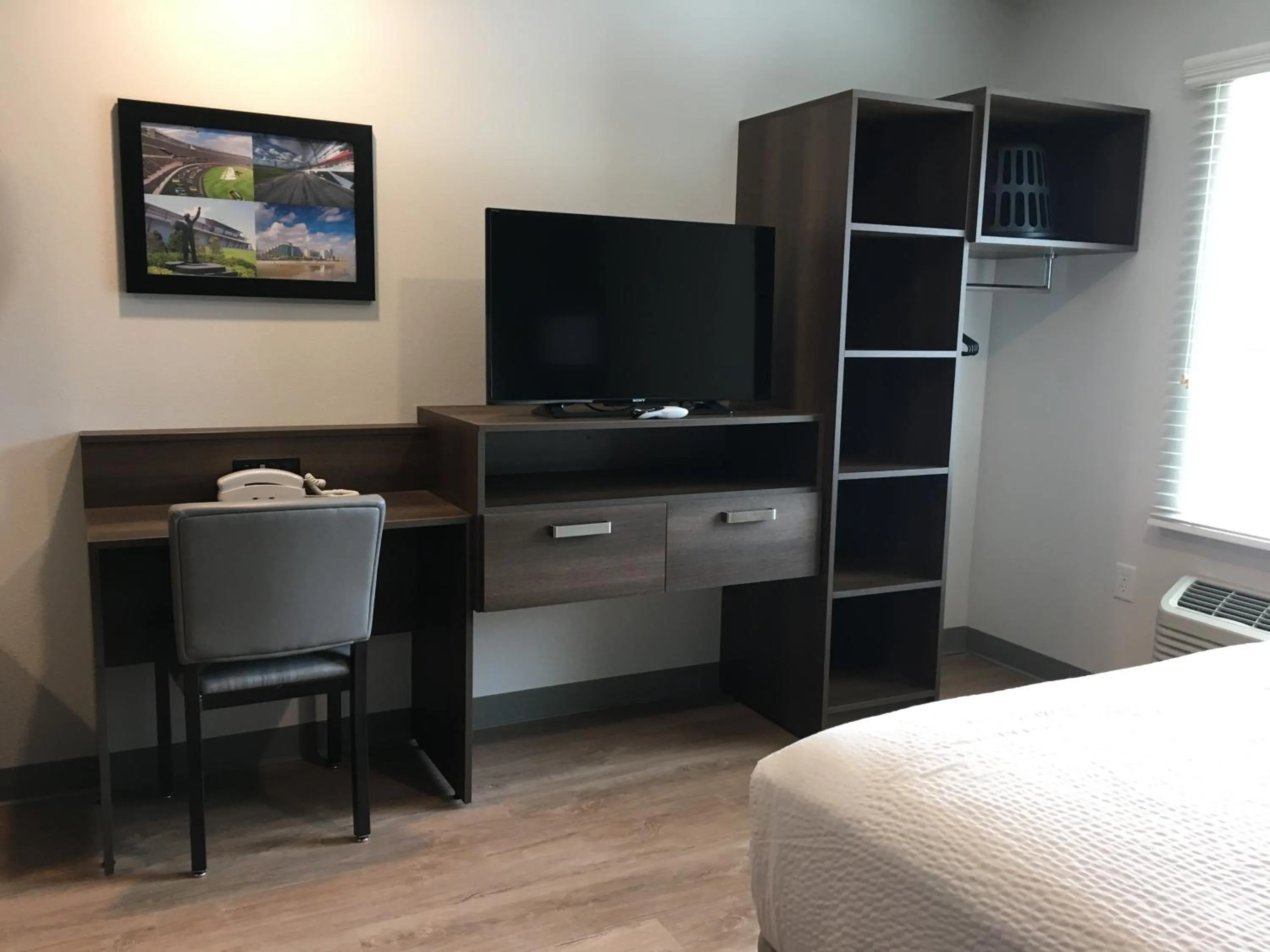 wardrobe, Bed in WoodSpring Suites Daytona Beach Int'l Speedway