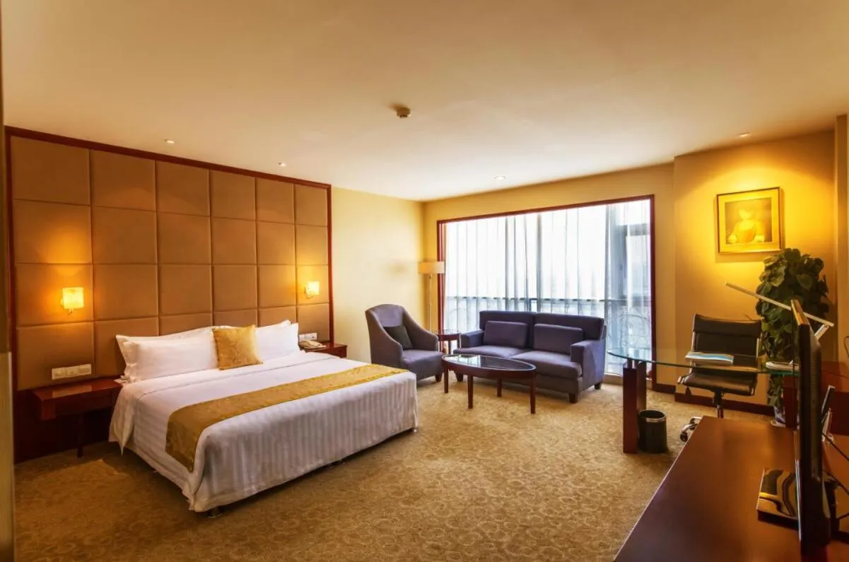 Bed in Yantai Meiya International ApartHotel (Previous Ramada Plaza)