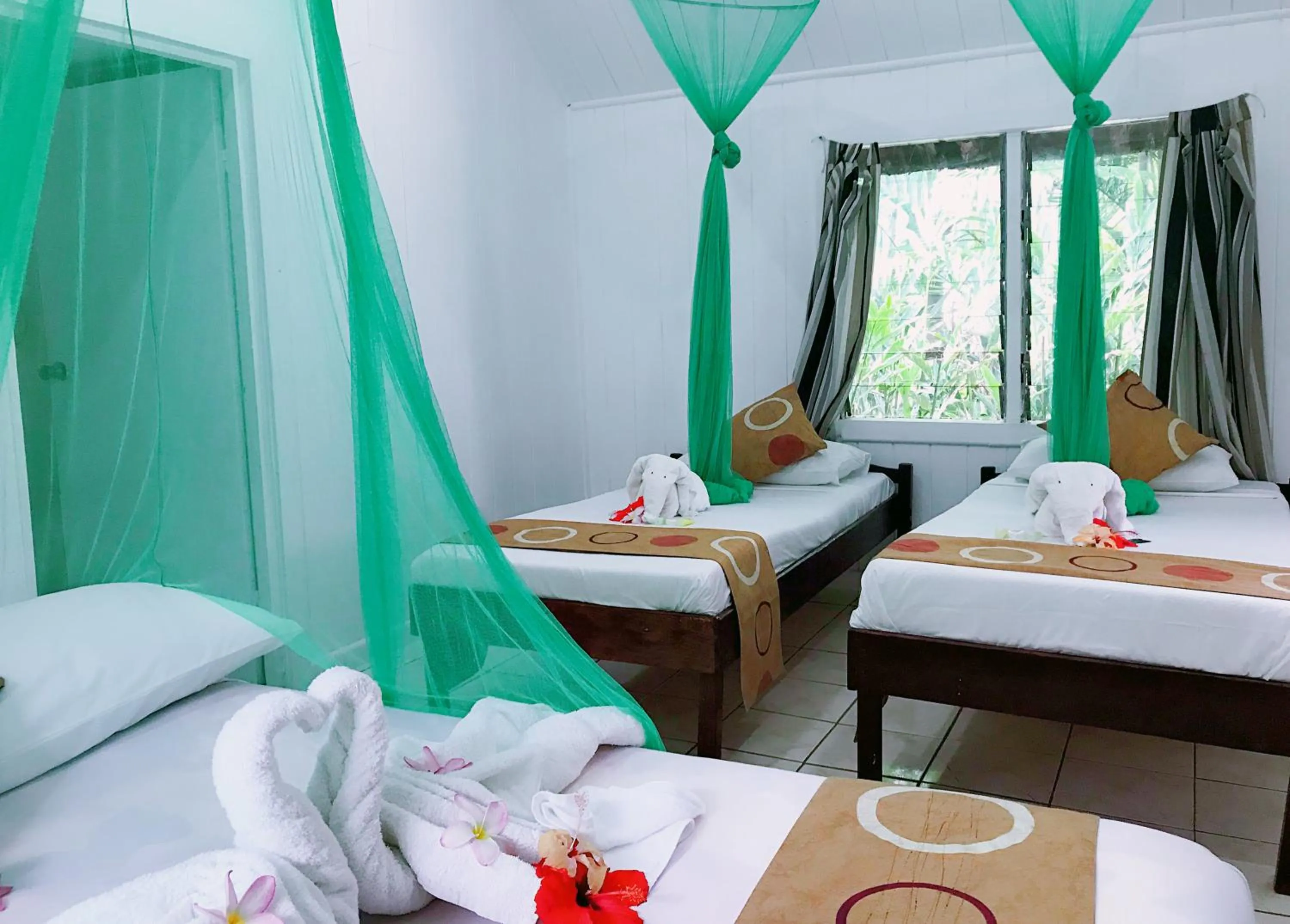 Bed in Tanna Evergreen Resort & Tours