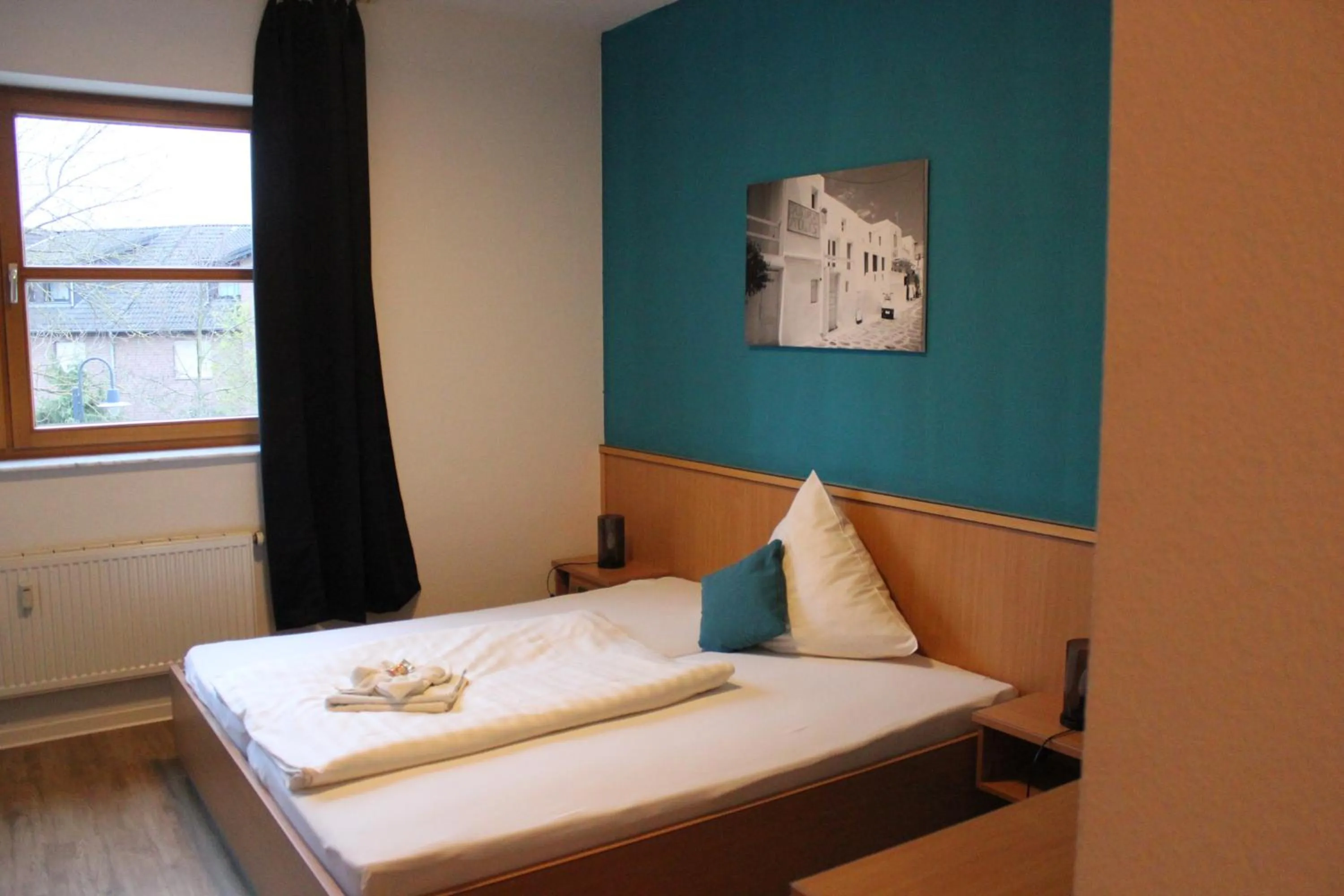 Bed in Olympia Hotel & Restaurant