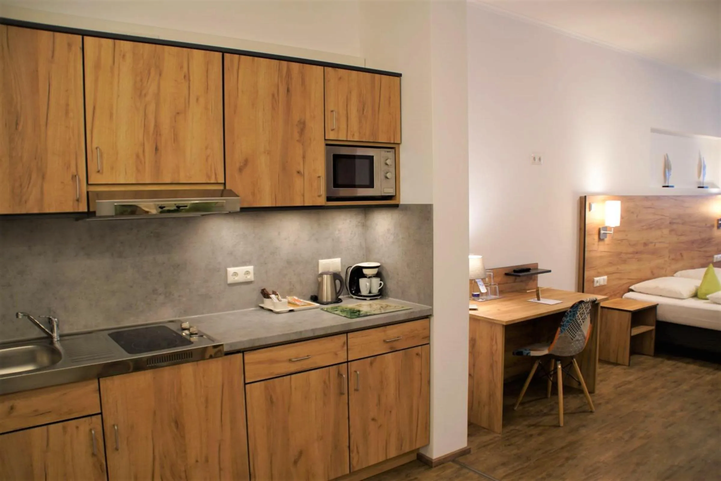 Kitchen or kitchenette, Bed in Maiers Hotel Parsberg
