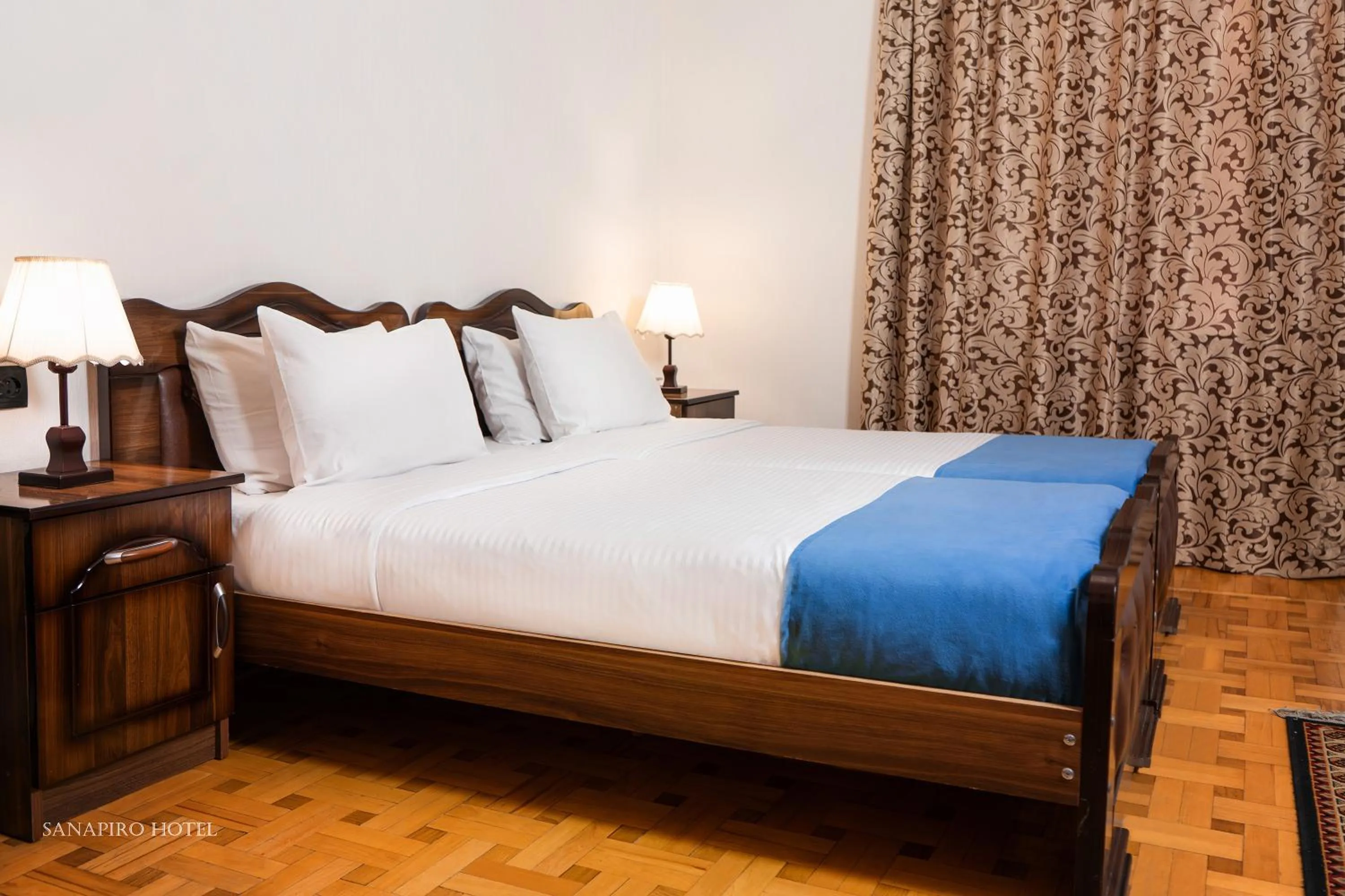 Bed in Sanapiro Hotel