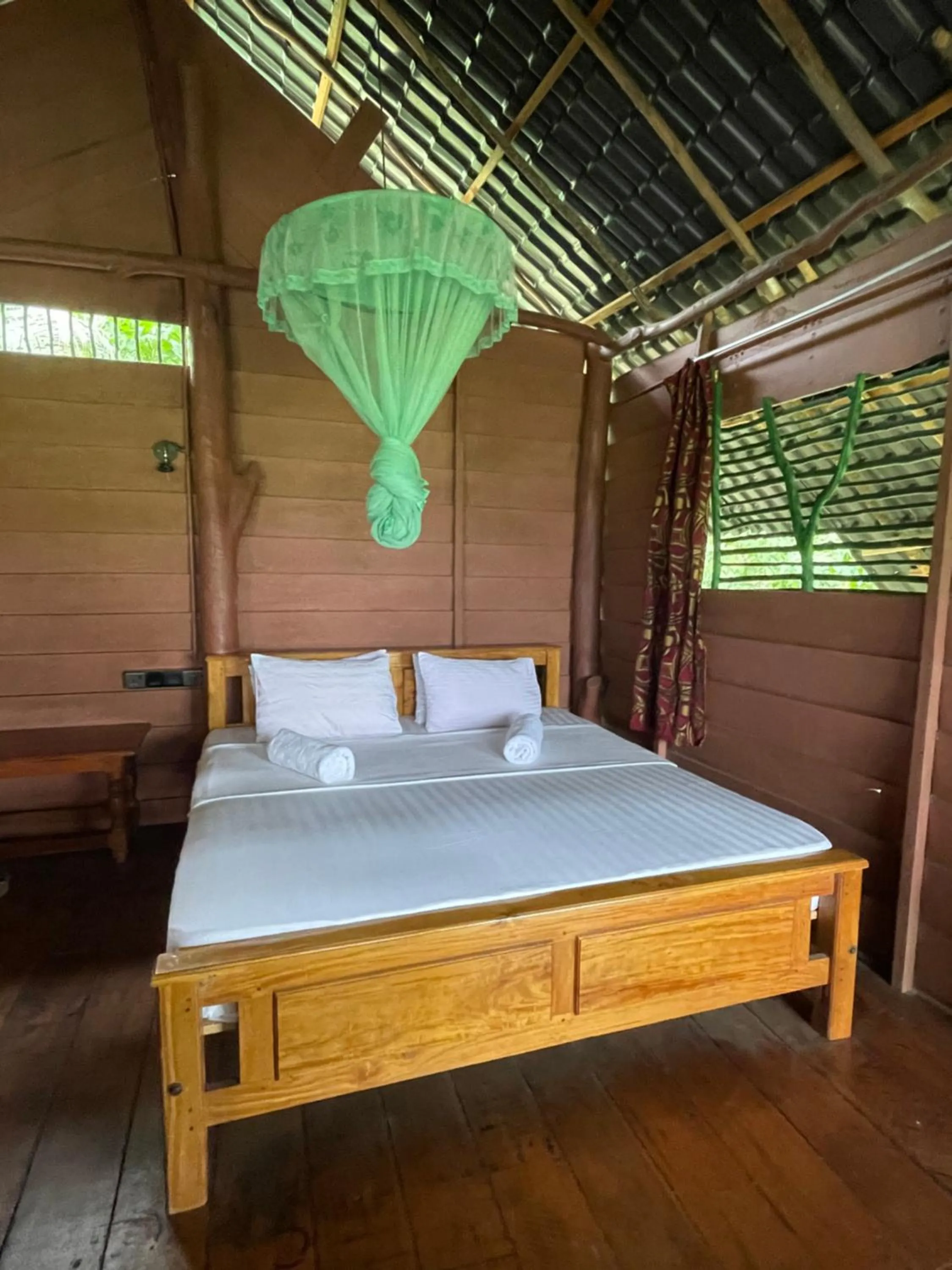 Bed in LakeSide Cabana Tissamaharama