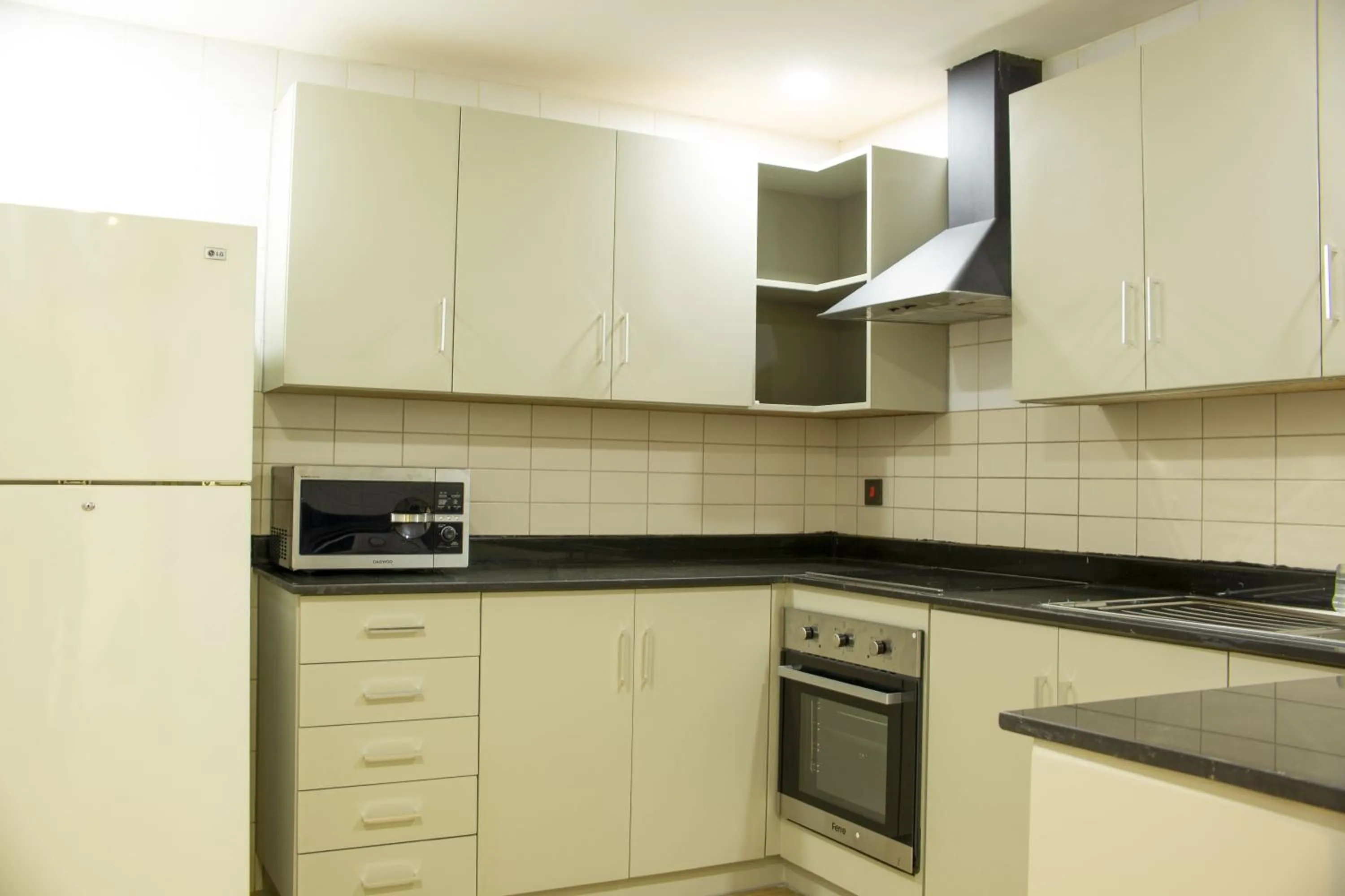 Kitchen or kitchenette in Infinity Tower Suites WLL