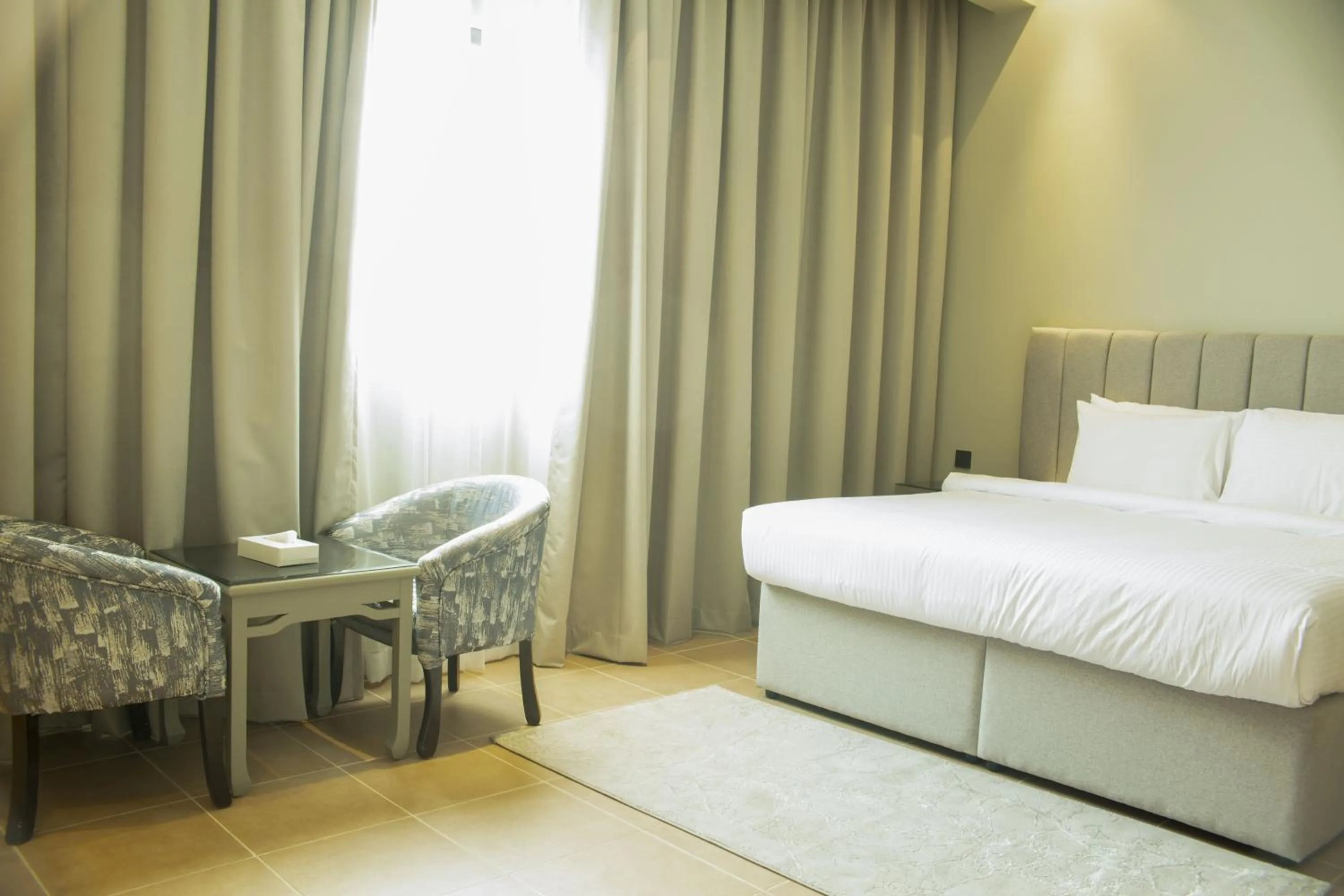 Photo of the whole room, Bed in Infinity Tower Suites WLL