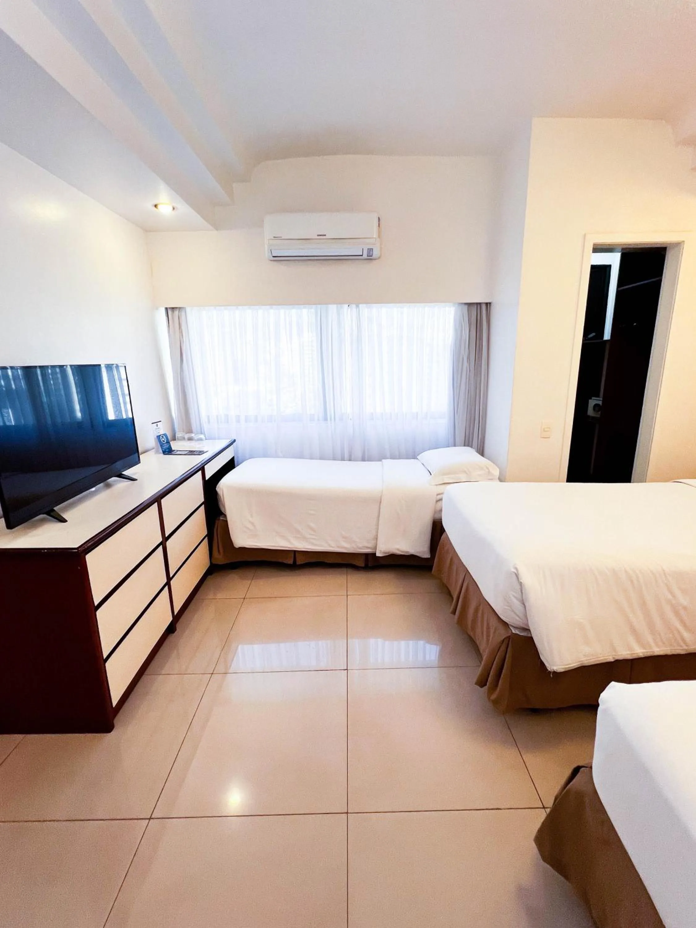 Bed in Royal Center Hotel Lourdes