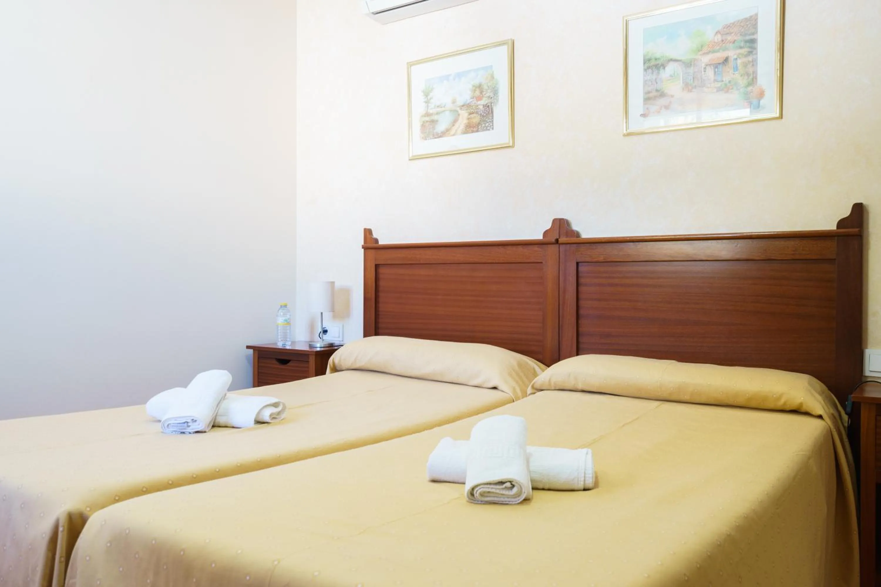 Bed in Hotel Carlos V Jerez by Vivere Stays