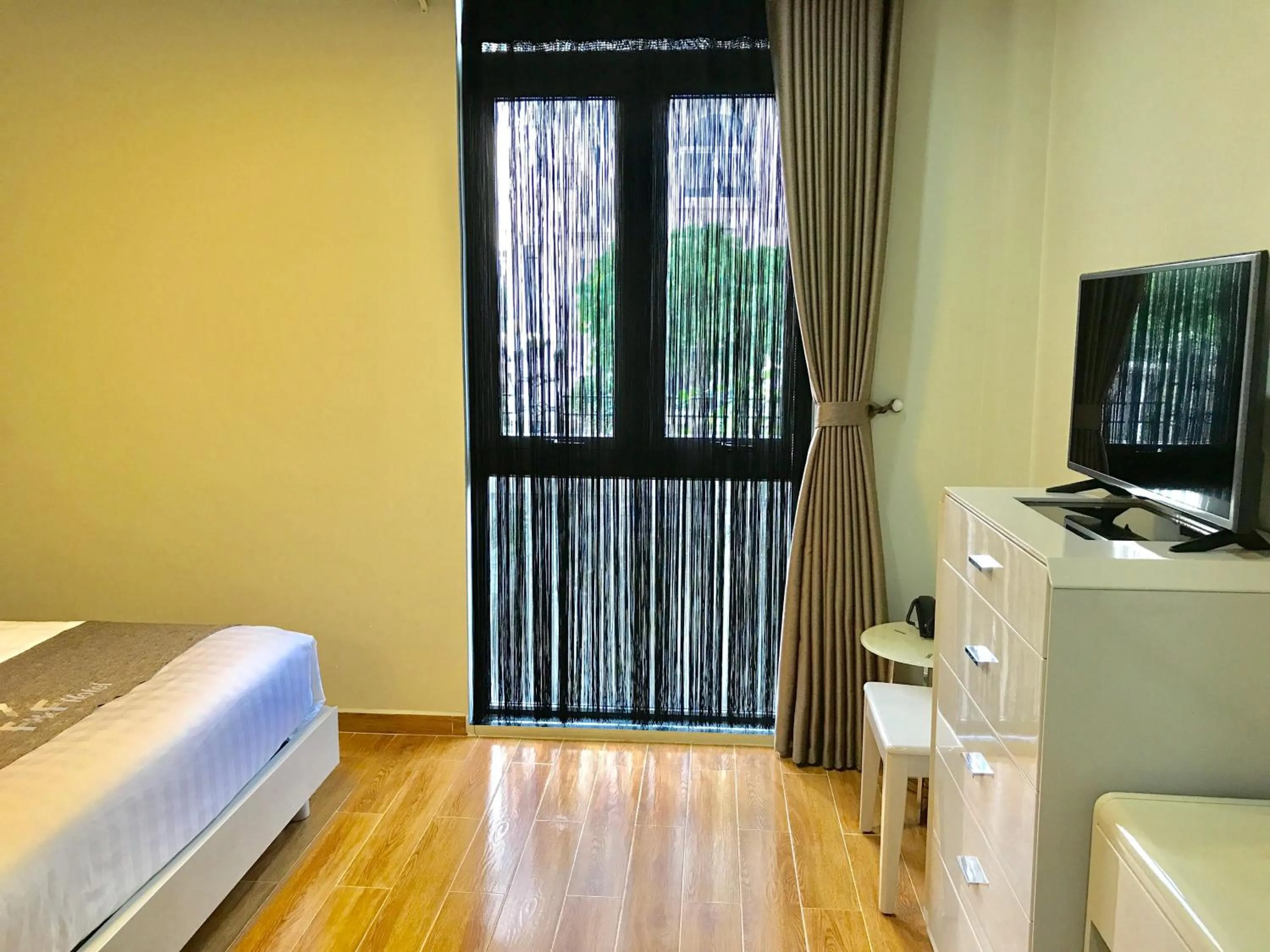 Photo of the whole room, Bed in F & F Hotel