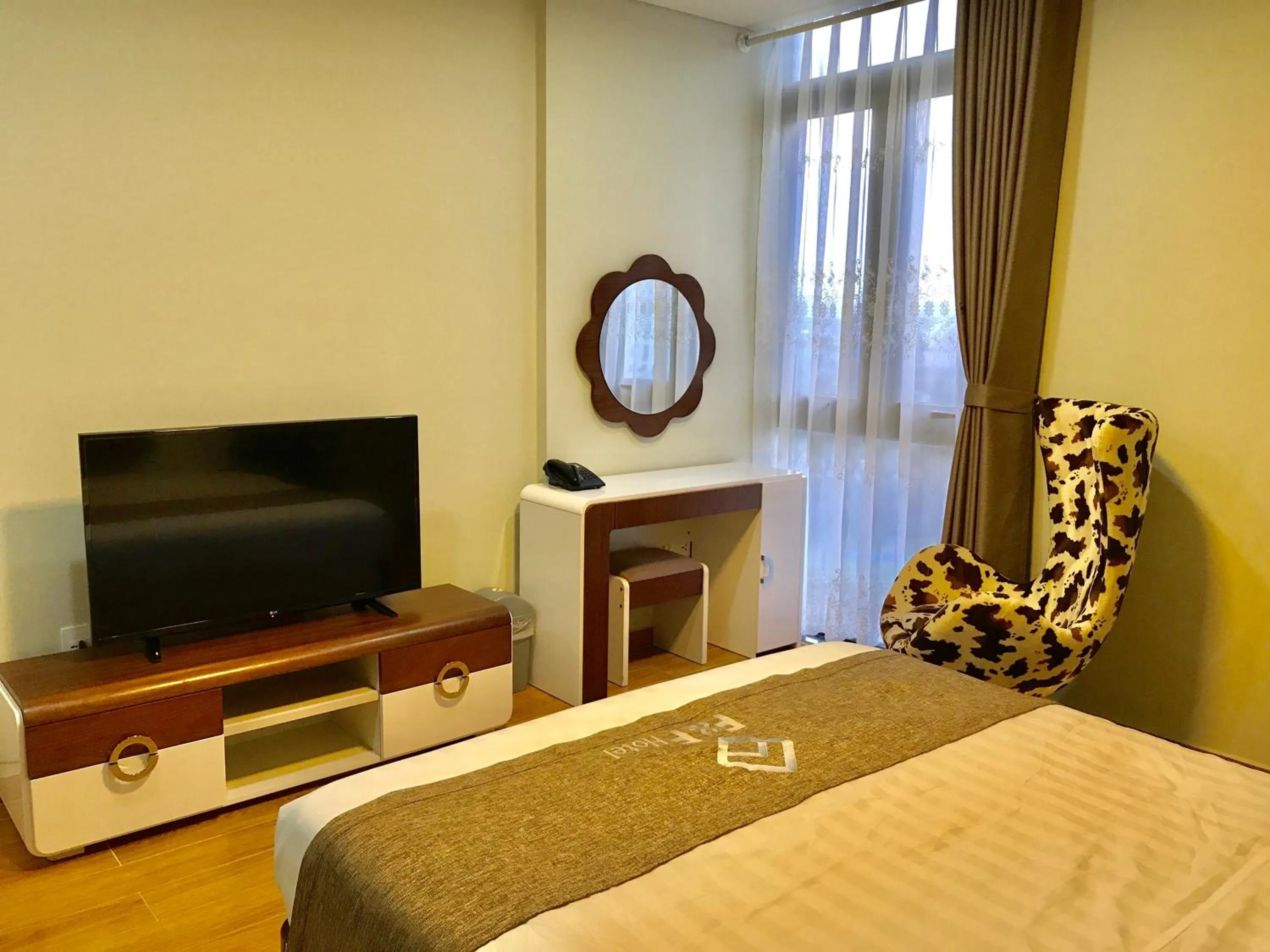 Photo of the whole room, Bed in F & F Hotel