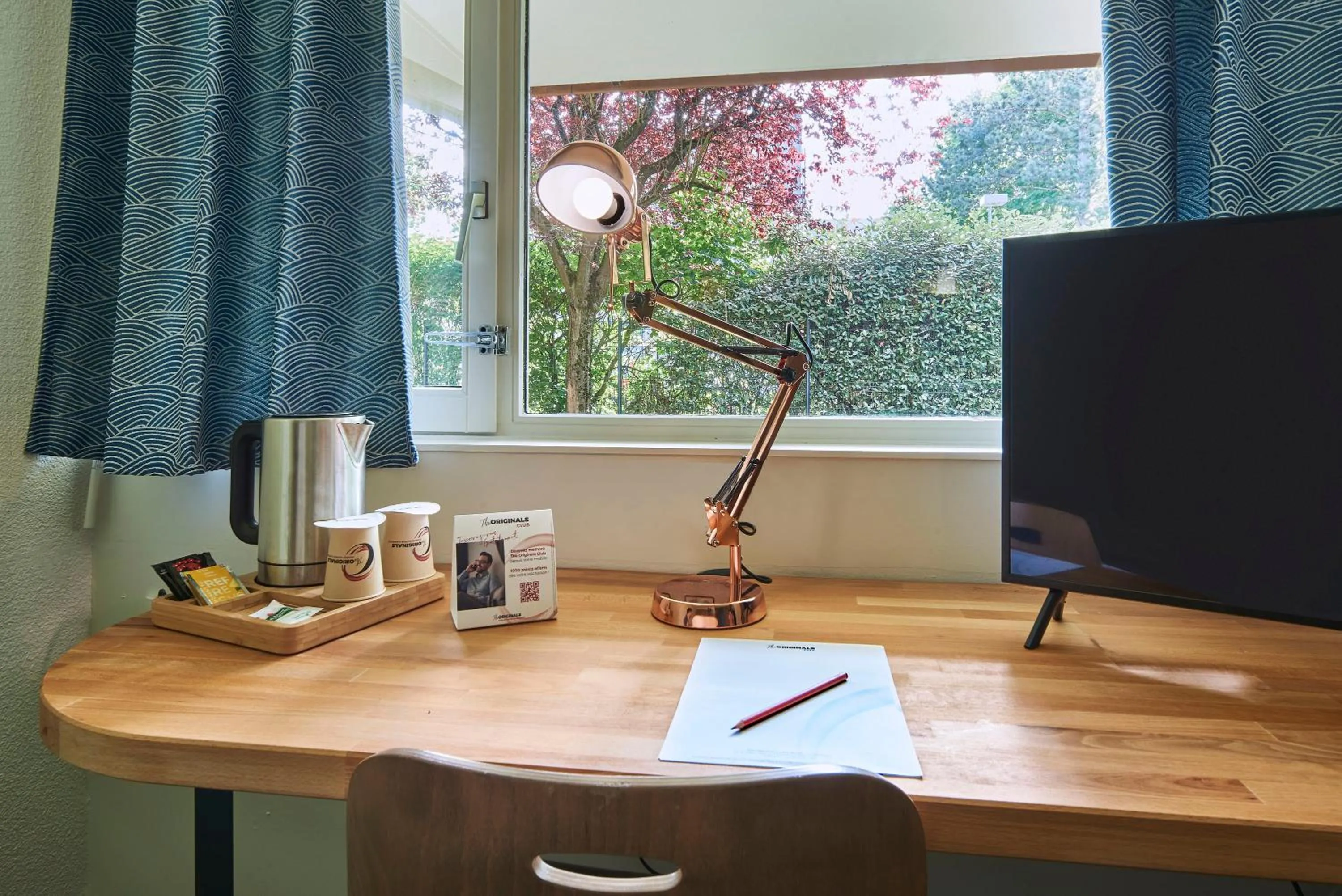 TV and multimedia in The Originals City Hôtel La Verrière-Yvelines