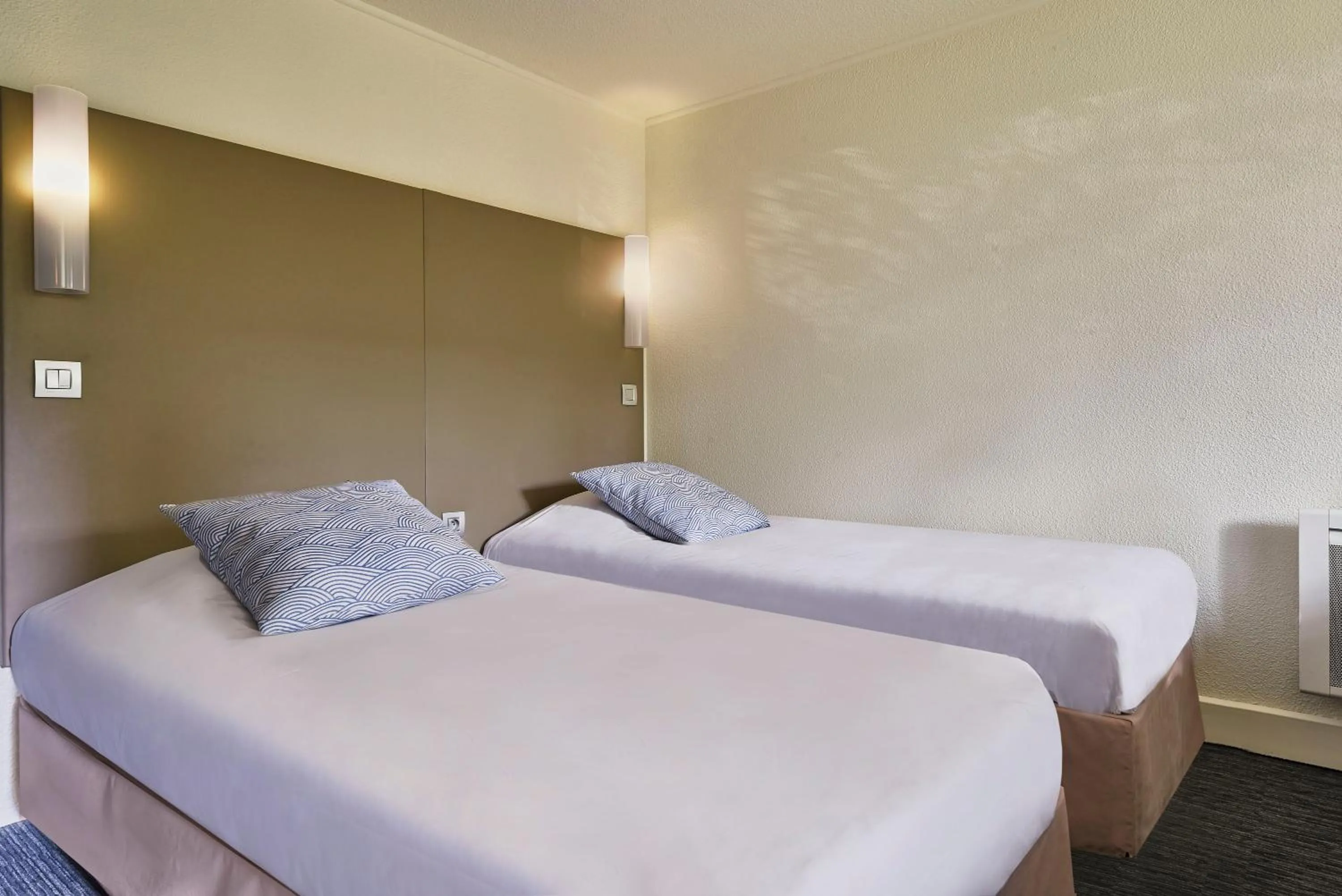 Bed in The Originals City Hôtel La Verrière-Yvelines