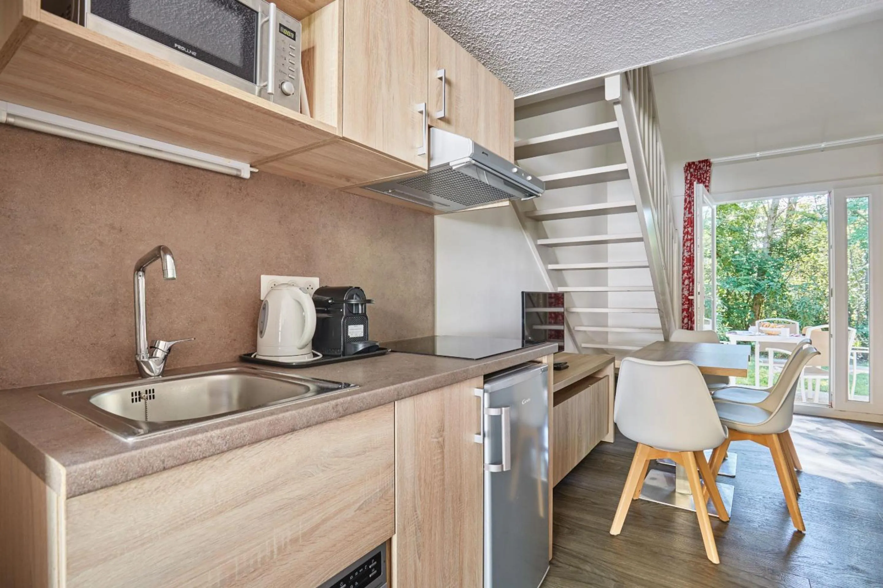 Kitchen or kitchenette in Résidence Odalys Le Village Camarguais Les Gardians