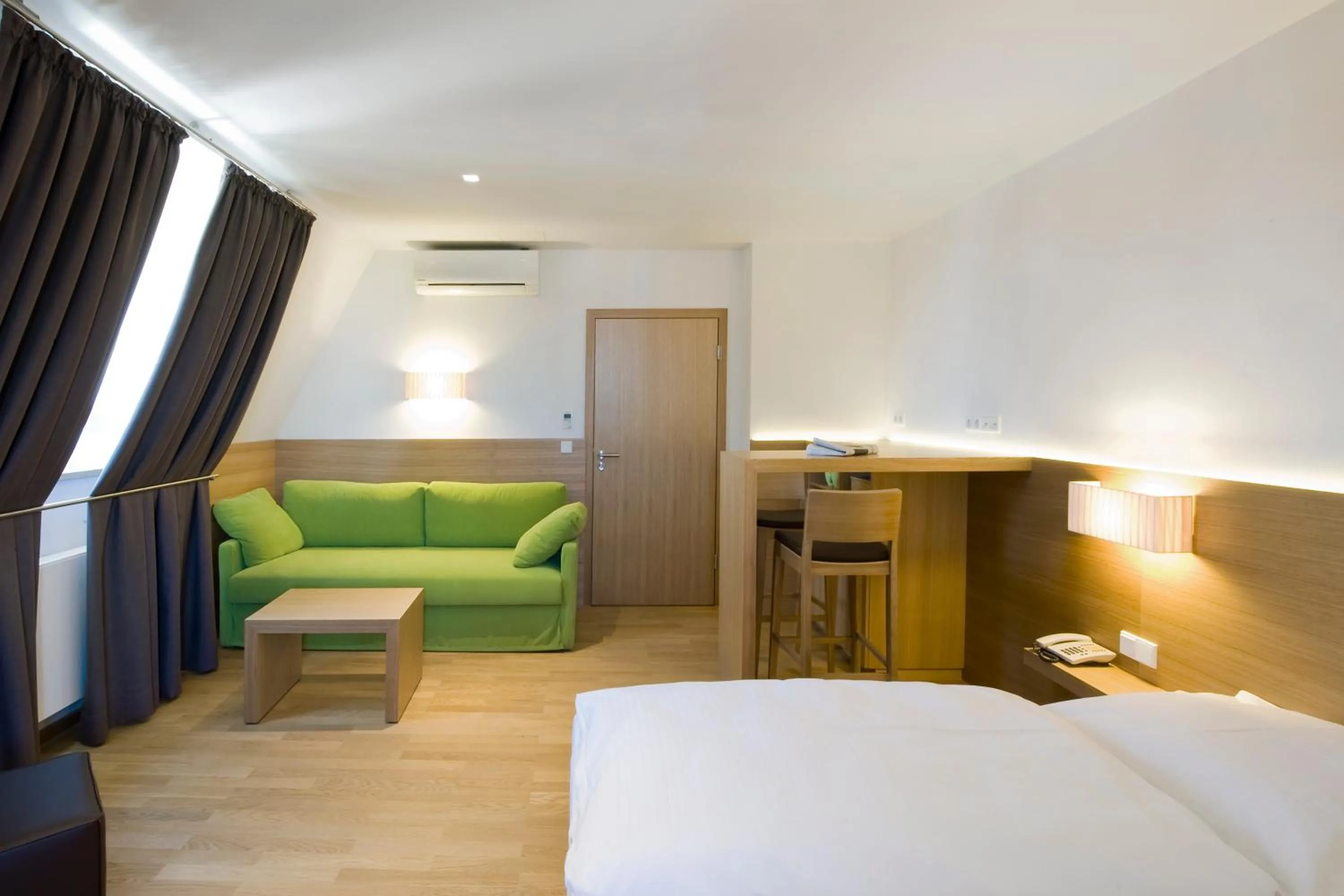 Seating area, Bed in Hotel Thalmair