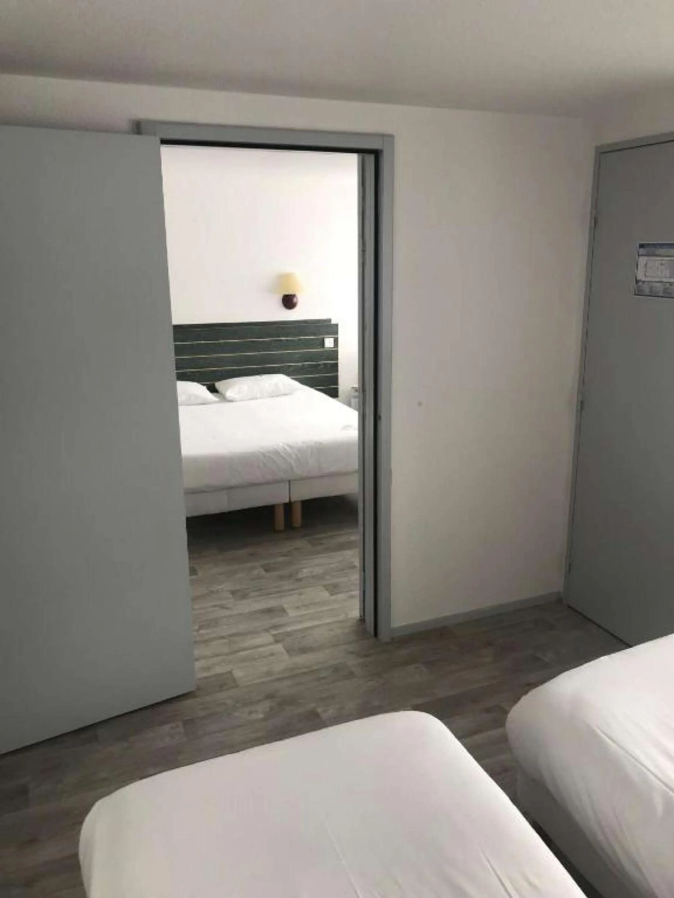 Bedroom, Bed in BRIT HOTEL Confort MORLAIX