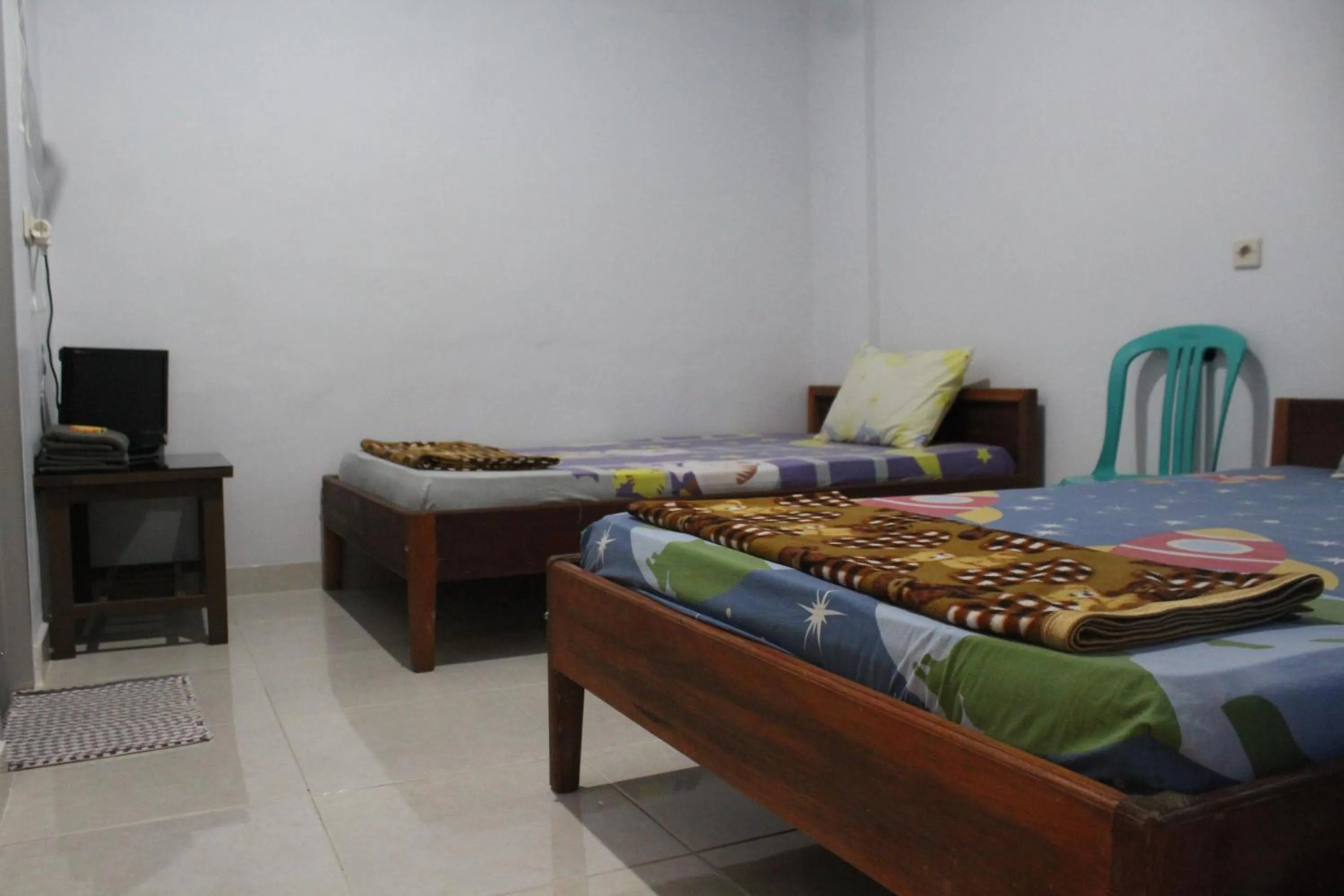 Photo of the whole room, Bed in Penginapan Artha