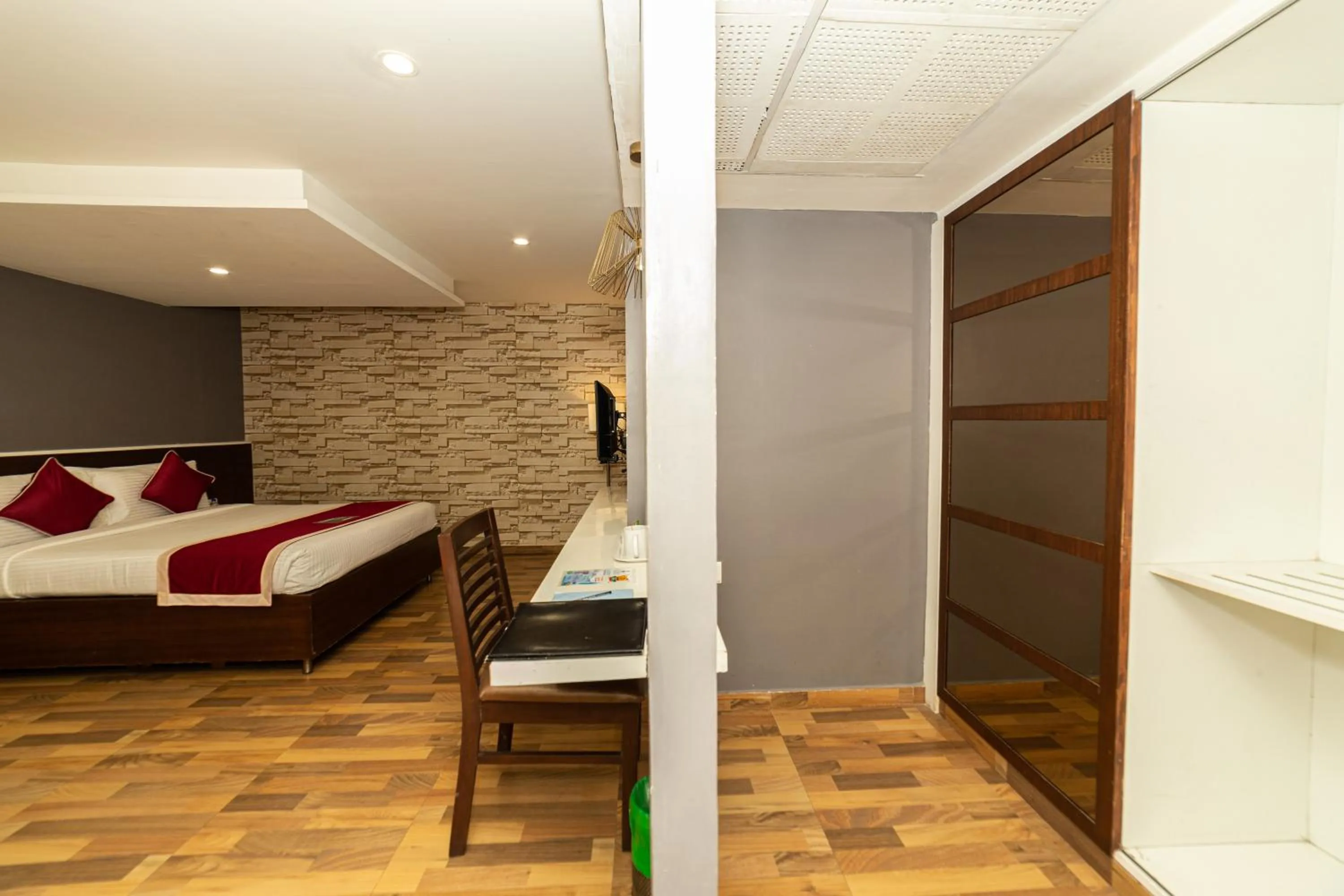 Bed in Icon Business Hotel by Bhagini