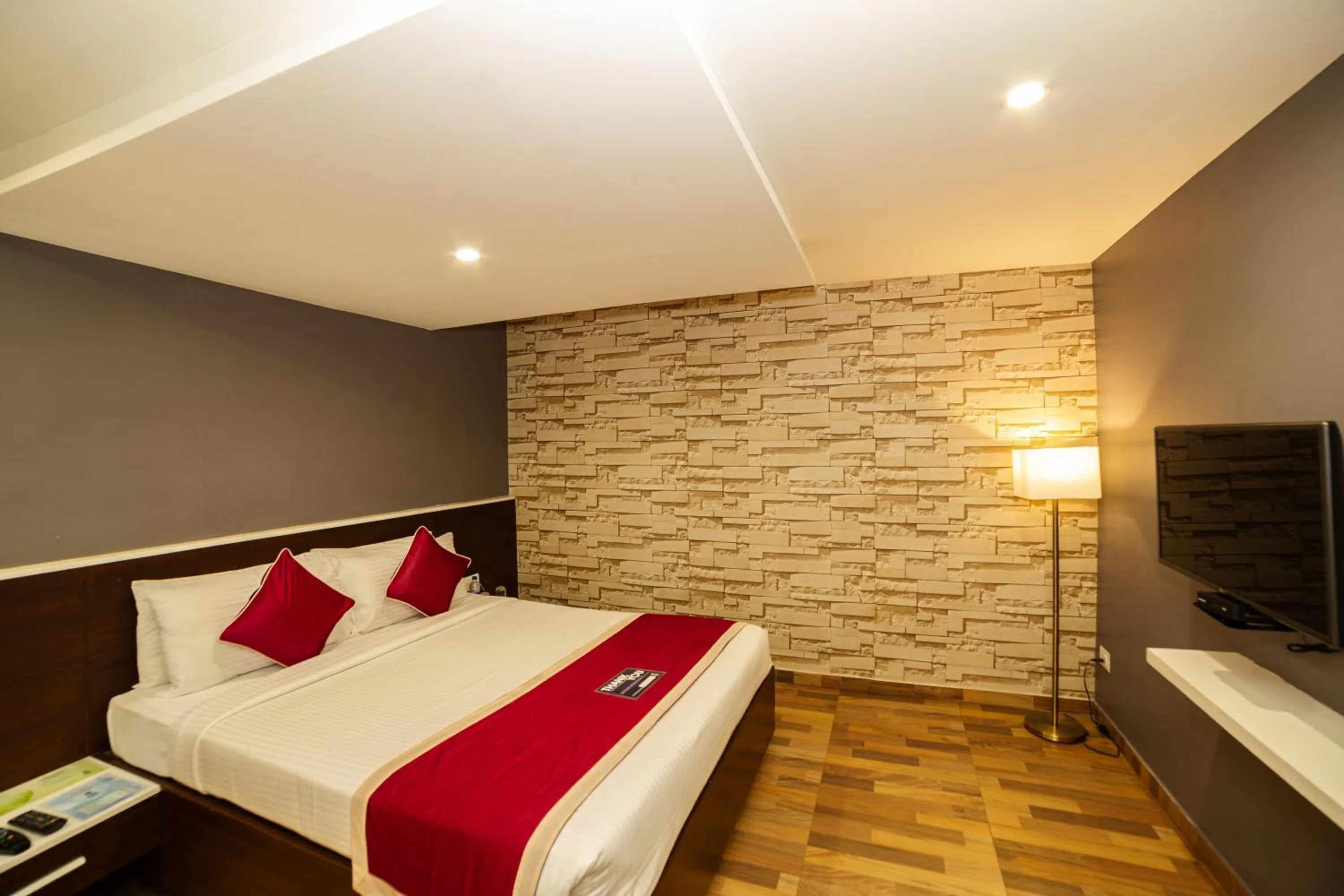 Bed in Icon Business Hotel by Bhagini