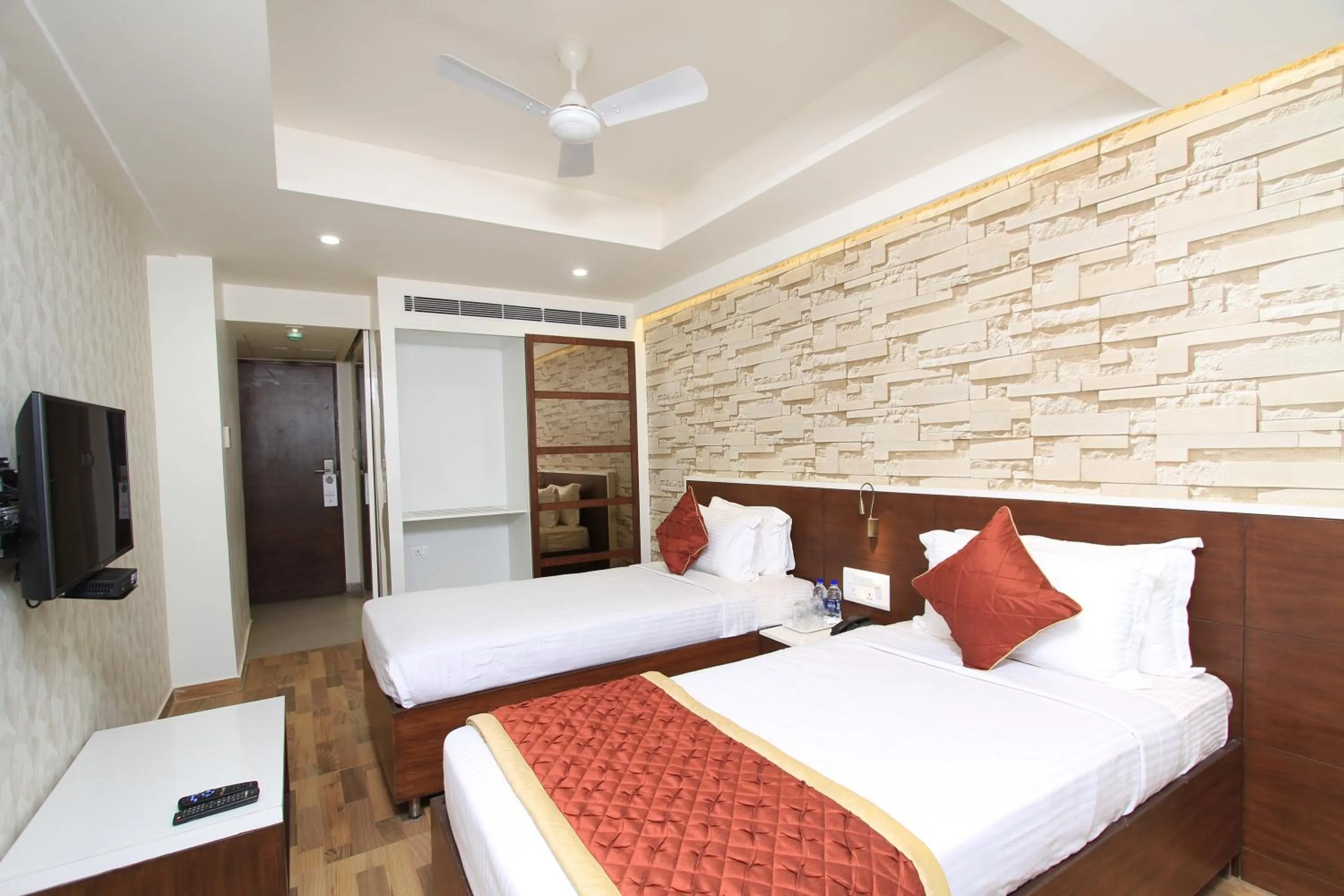 Bed in Icon Business Hotel by Bhagini