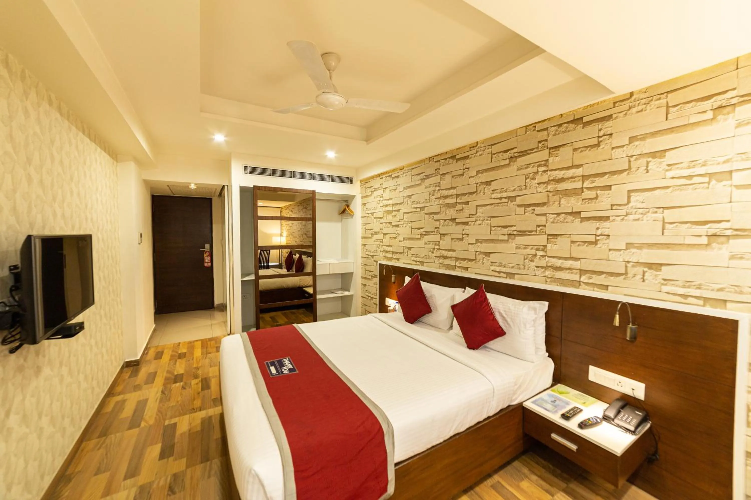 Bed in Icon Business Hotel by Bhagini