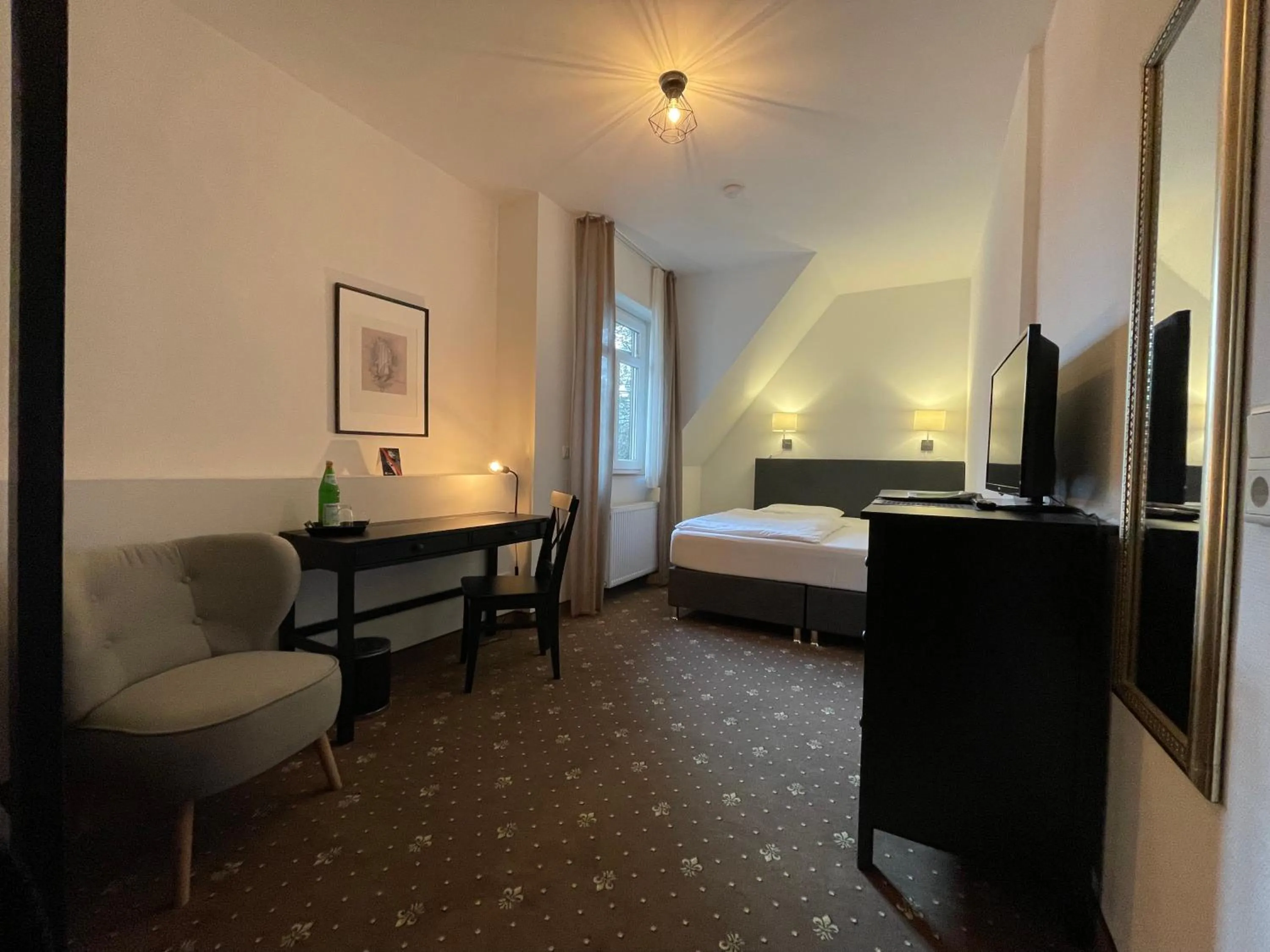 Living room, Bed in dS Hotel Gronau