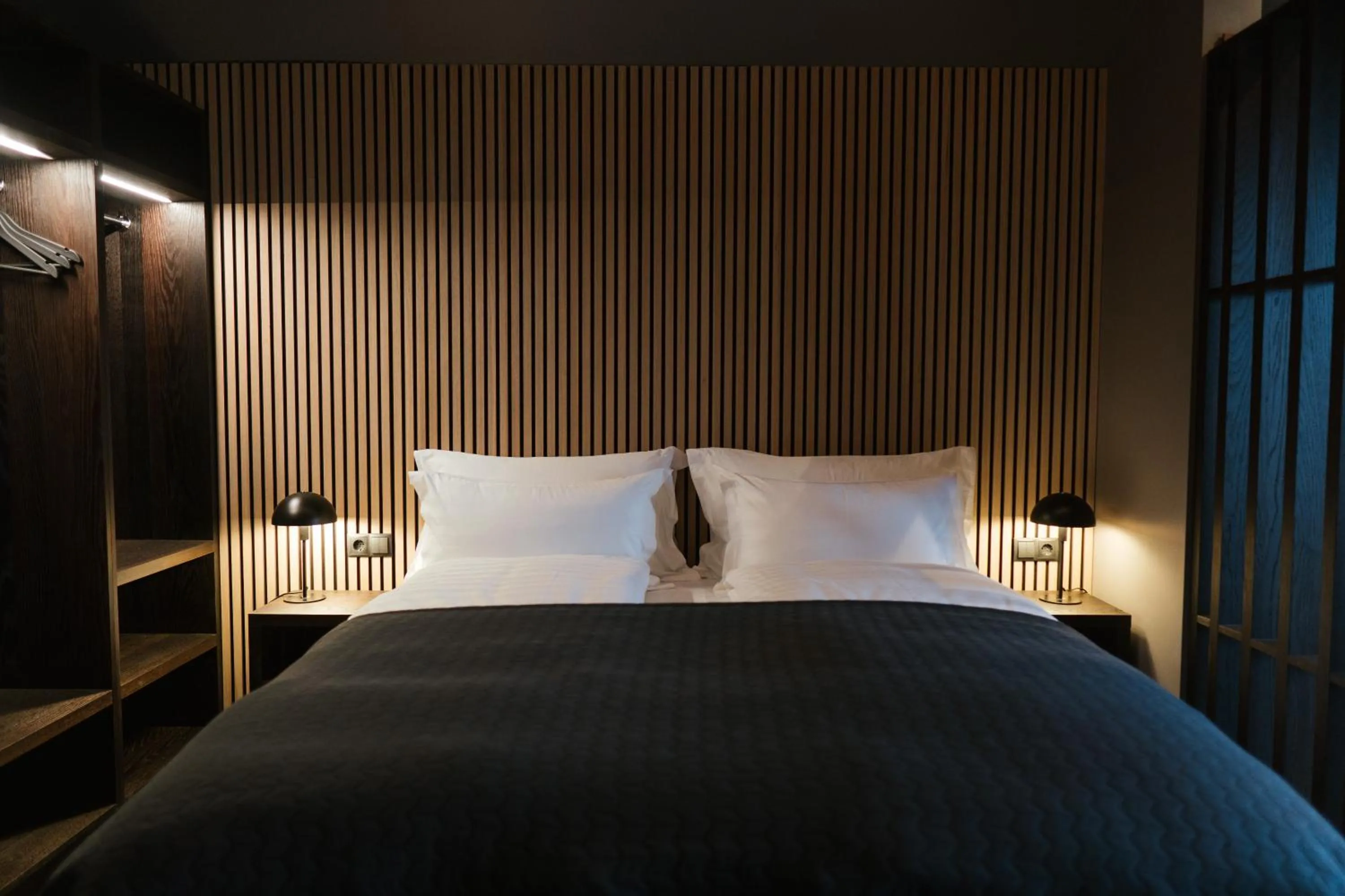 Bed in Black Beach Suites