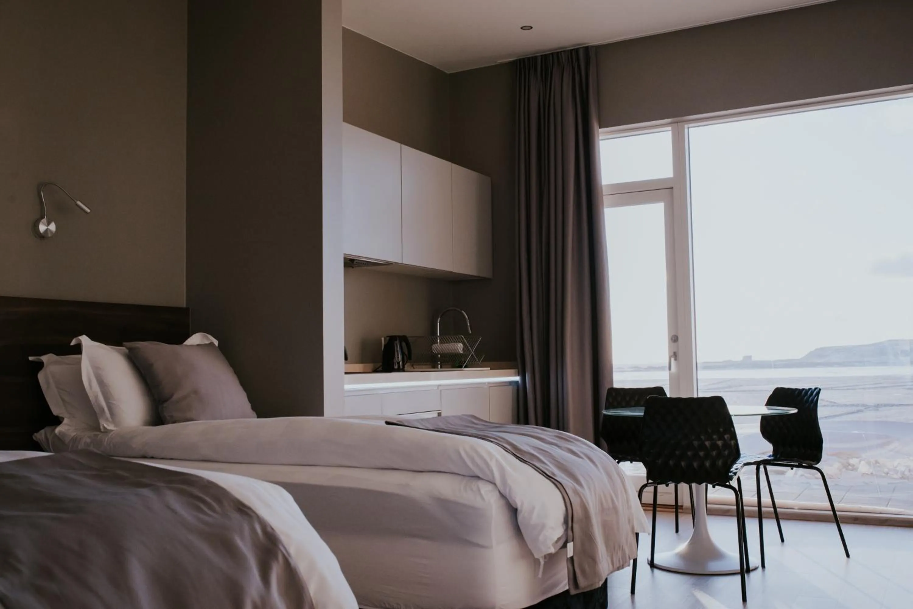 Bed in Black Beach Suites