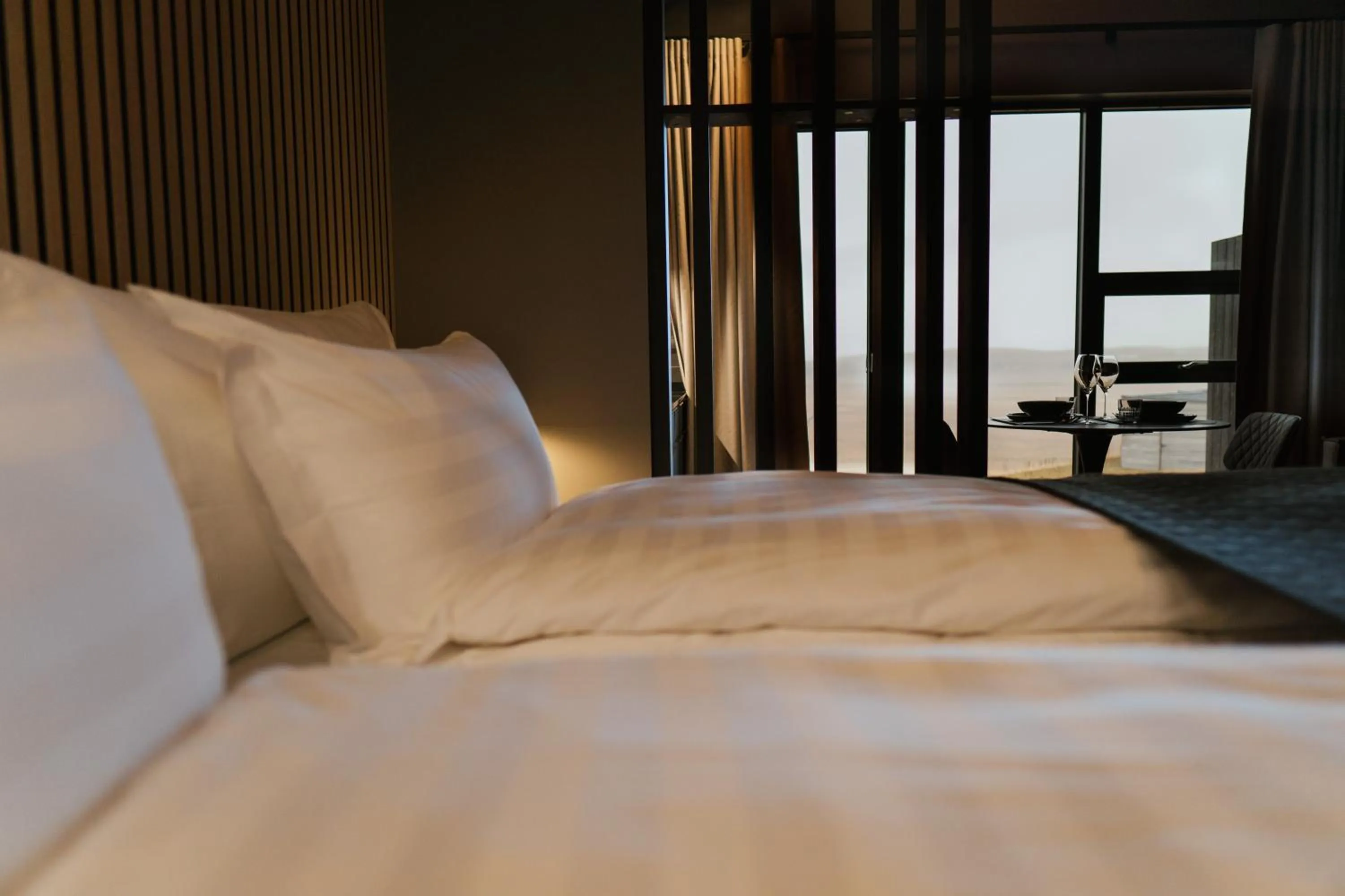 Bed in Black Beach Suites