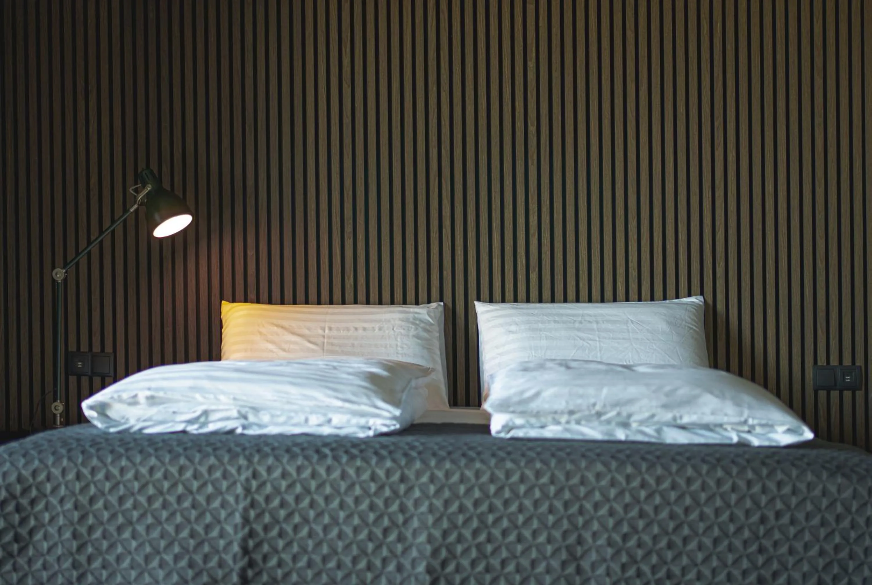 Bed in Black Beach Suites