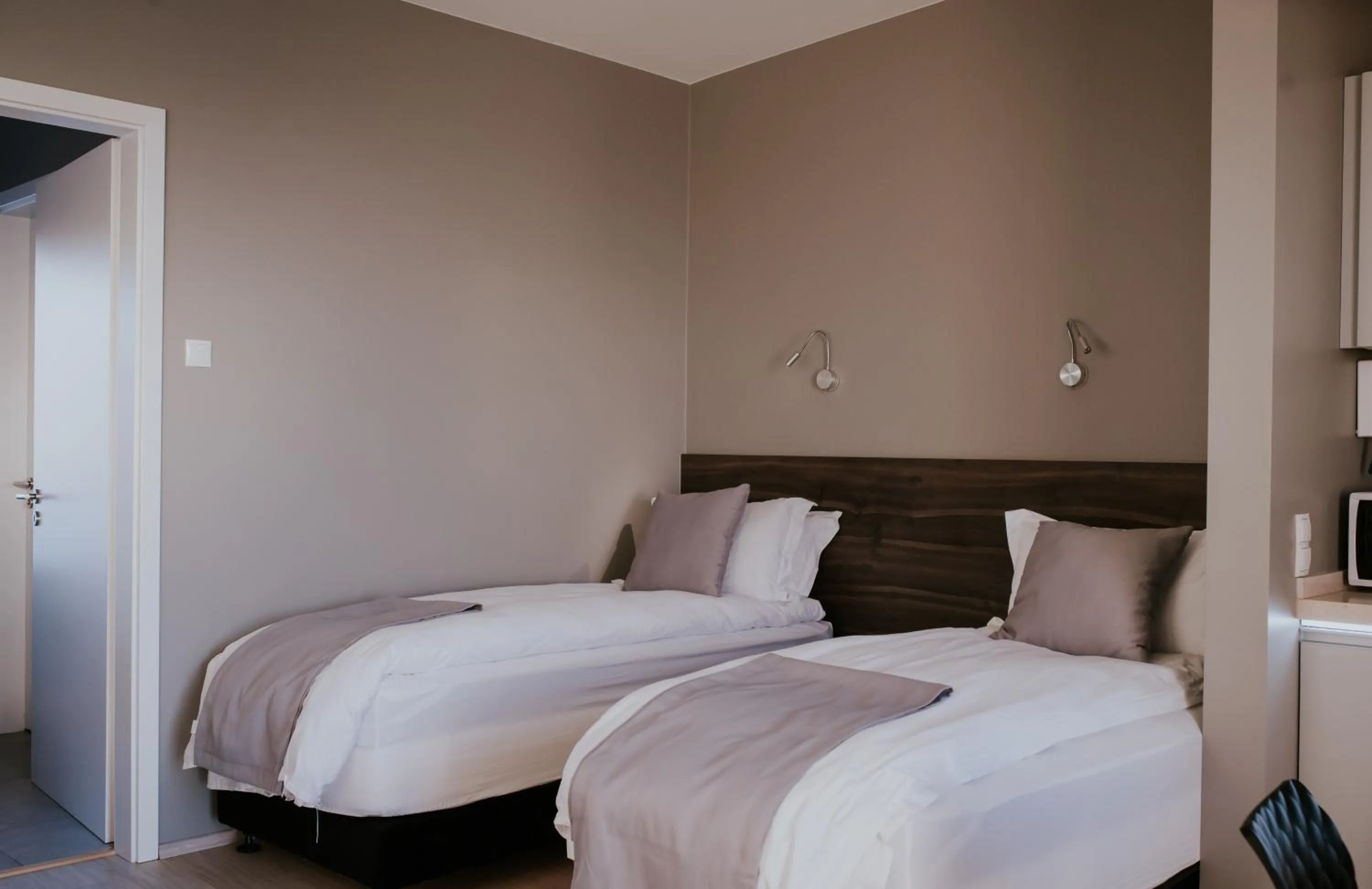 Bed in Black Beach Suites