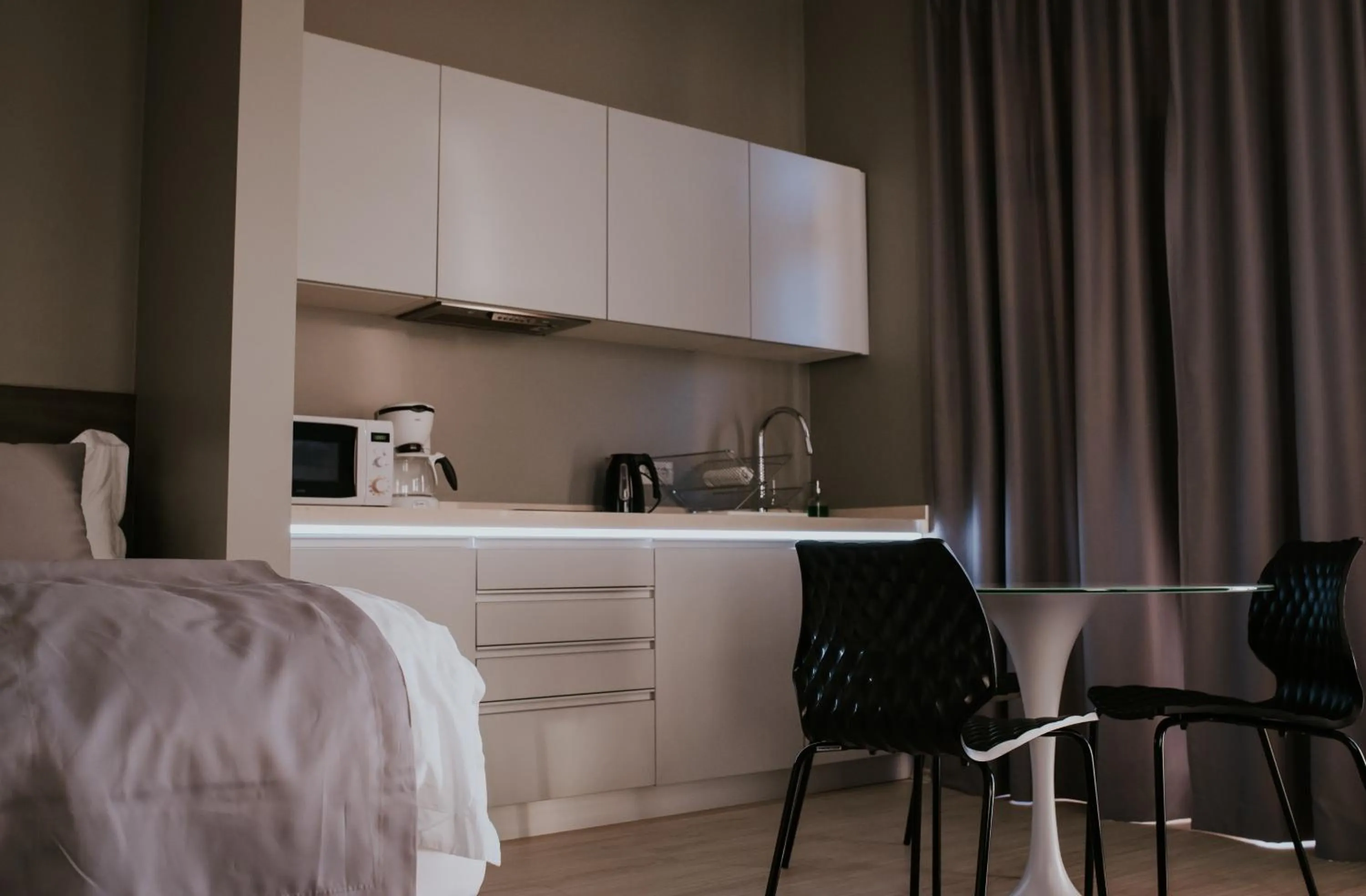 Bed in Black Beach Suites